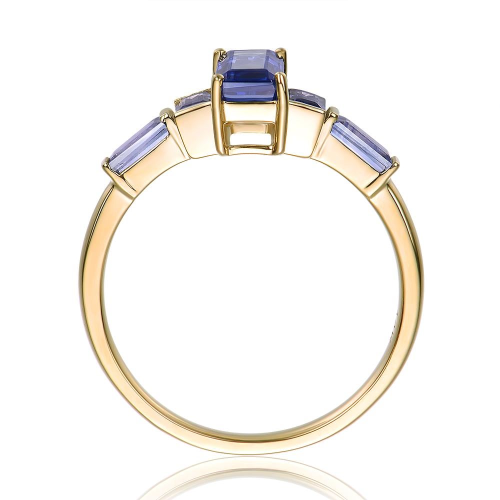 1.5ct emerald cut montana sapphire with a diamond paved setting
