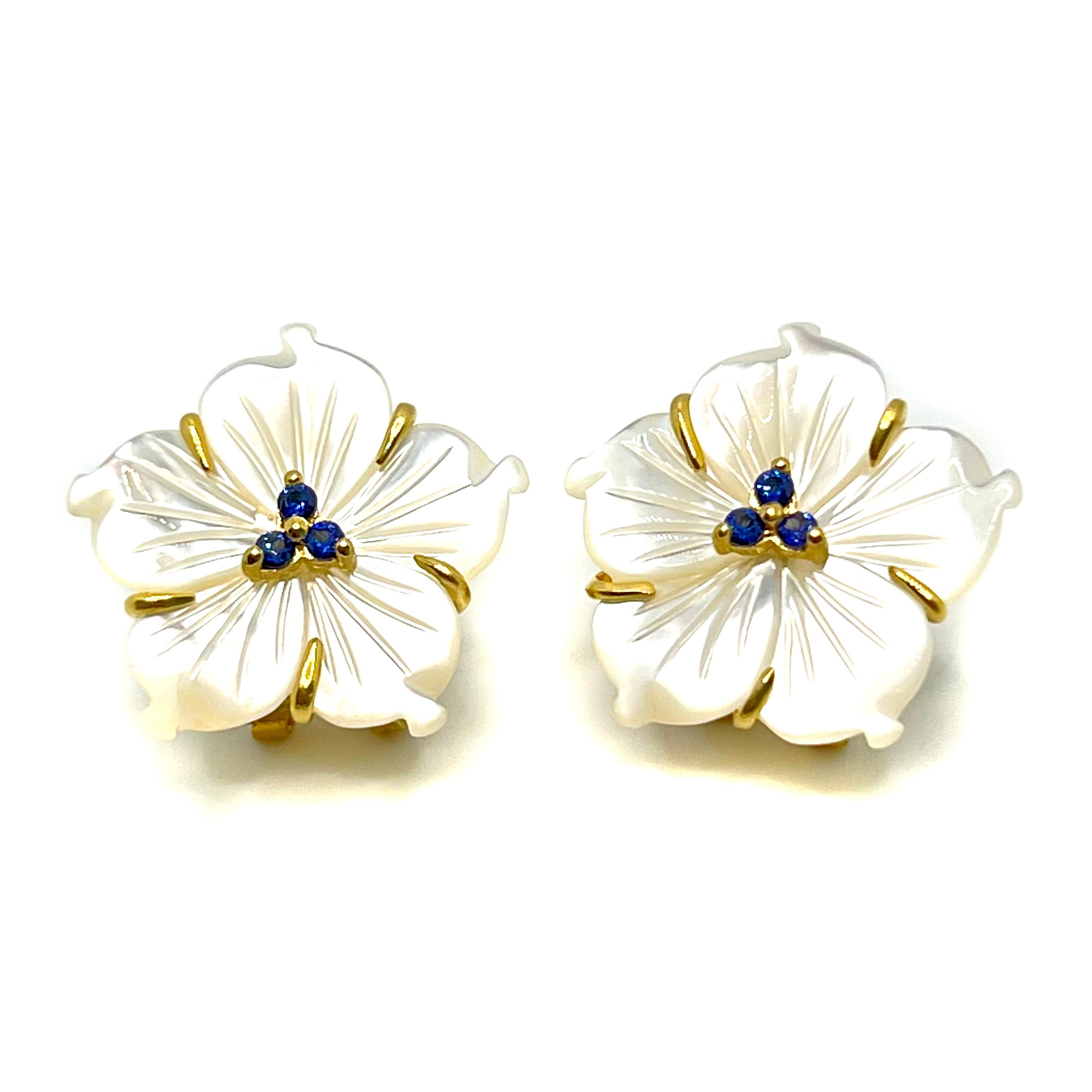 Elegant 23mm Carved Mother of Pearl Flower with lab-grown sapphire center Earrings

This gorgeous pair of earrings features 23mm mother of pearl carved into beautiful 3D flower, adorned with round lab-grown blue sapphire in the center, handset in