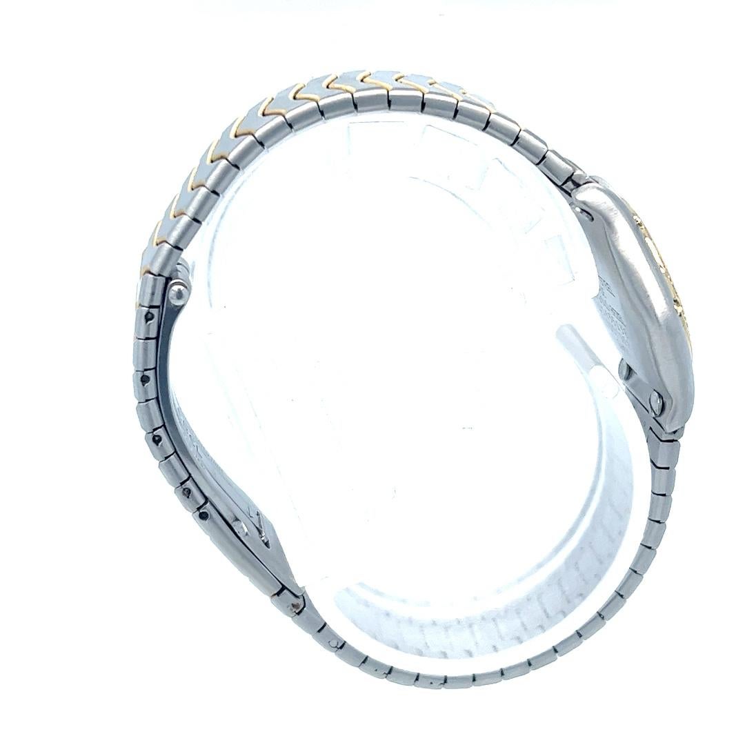 
Diese raffinierte und feminine, einzigartige 23 mm große Ebel Wave Mini Quarzuhr ist eine perfekte Mischung aus Luxus und alltäglicher Eleganz. Dieser elegante Zeitmesser aus zweifarbigem Edelstahl und Gelbgold verfügt über eine diamantbesetzte