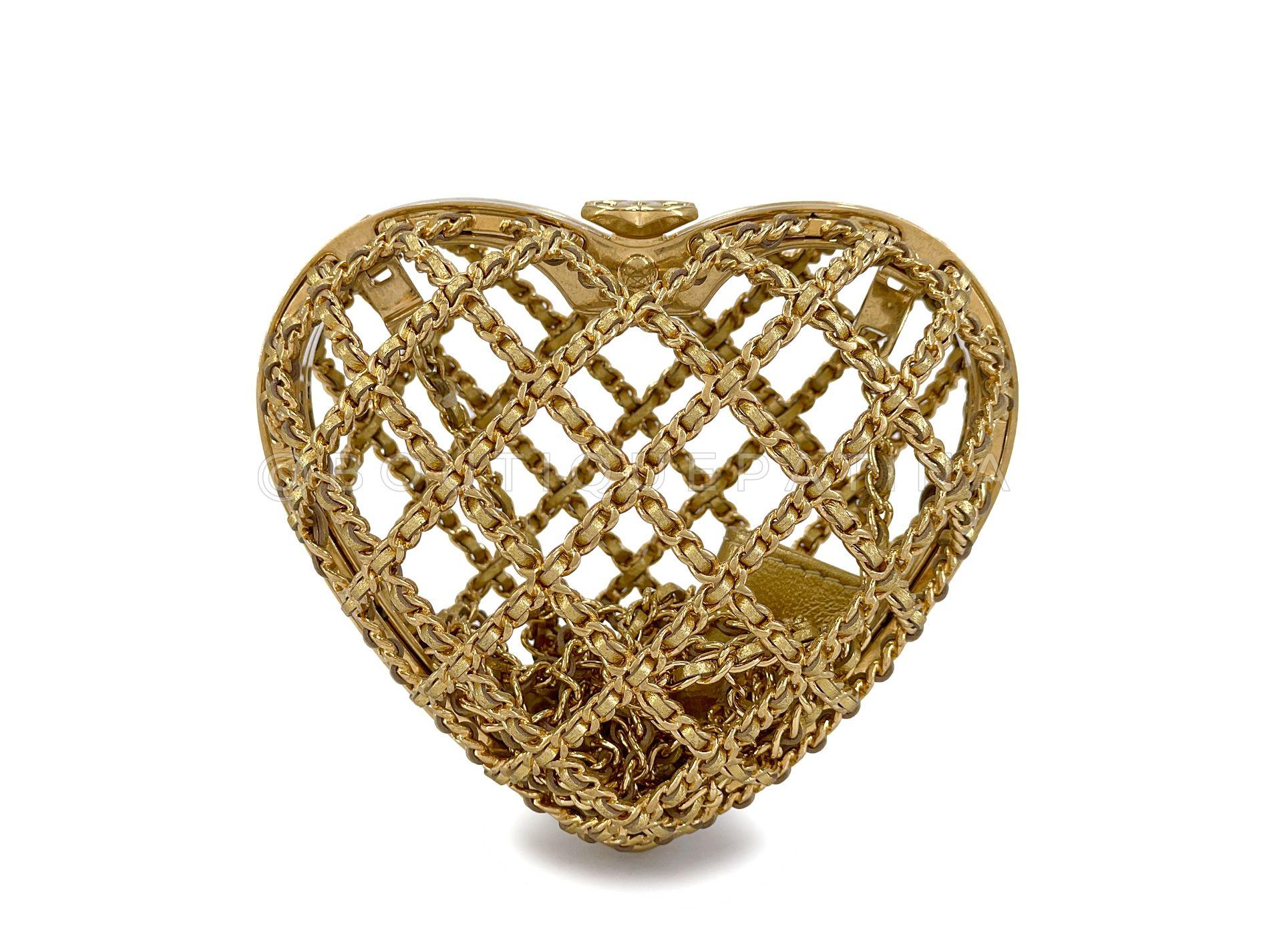 Store item: 68434
23S Chanel Caged Heart Minaudière Evening Clutch Bag Gold Small

There are two sizes of this caged heart - this is the smaller size in gold; as of the time of this listing, the larger woven black heart is also available. 

Chain
