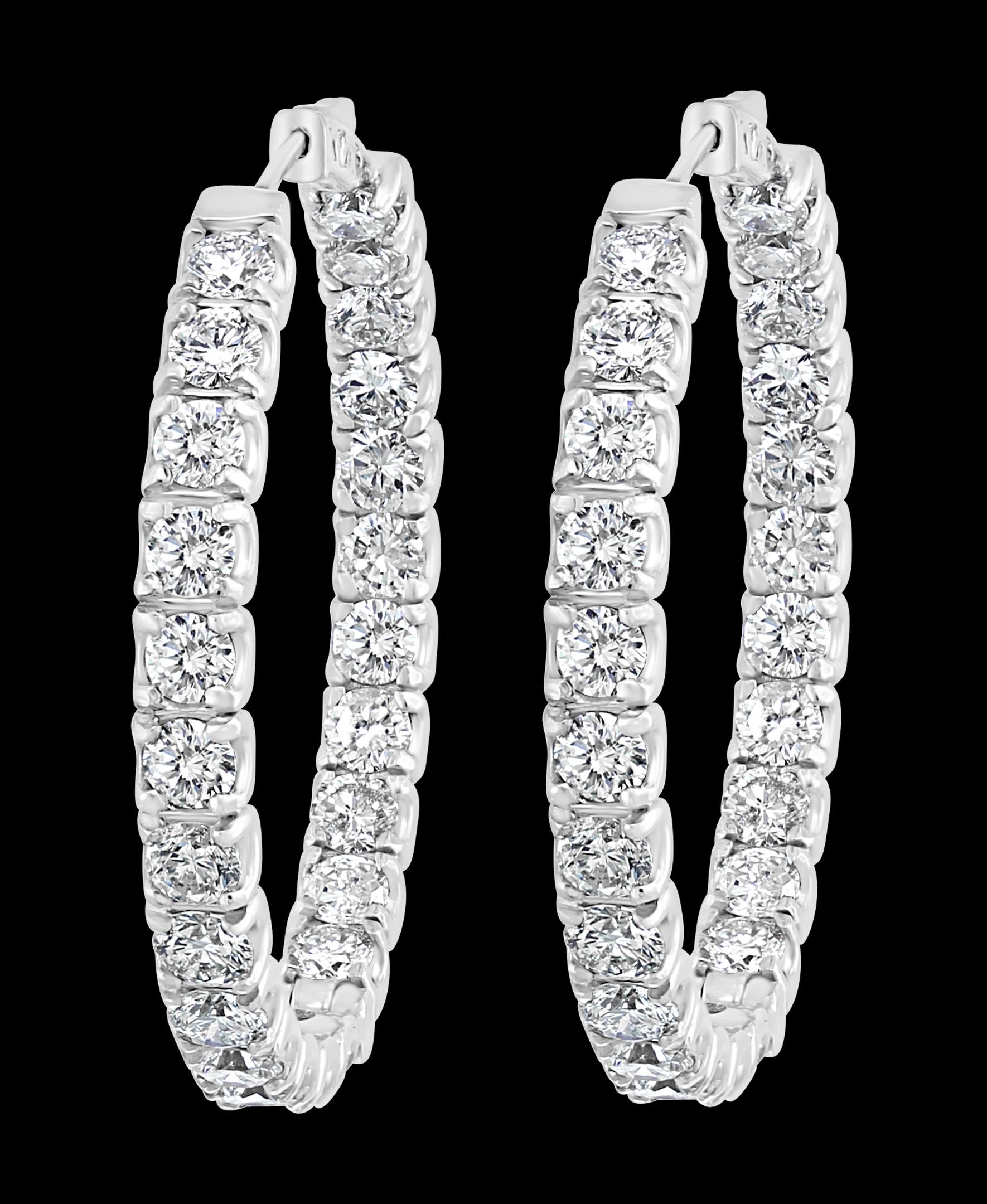 24 Carat, 50 Pointer Each Diamond  Inside Out Hoop Earrings 14 Karat White Gold
A fabulous pair of earrings with an enormous amount of look and sparkle!
Large Brilliant Round shape diamonds make a large Inside out Hoop
Clasp: push Lever clasp
14