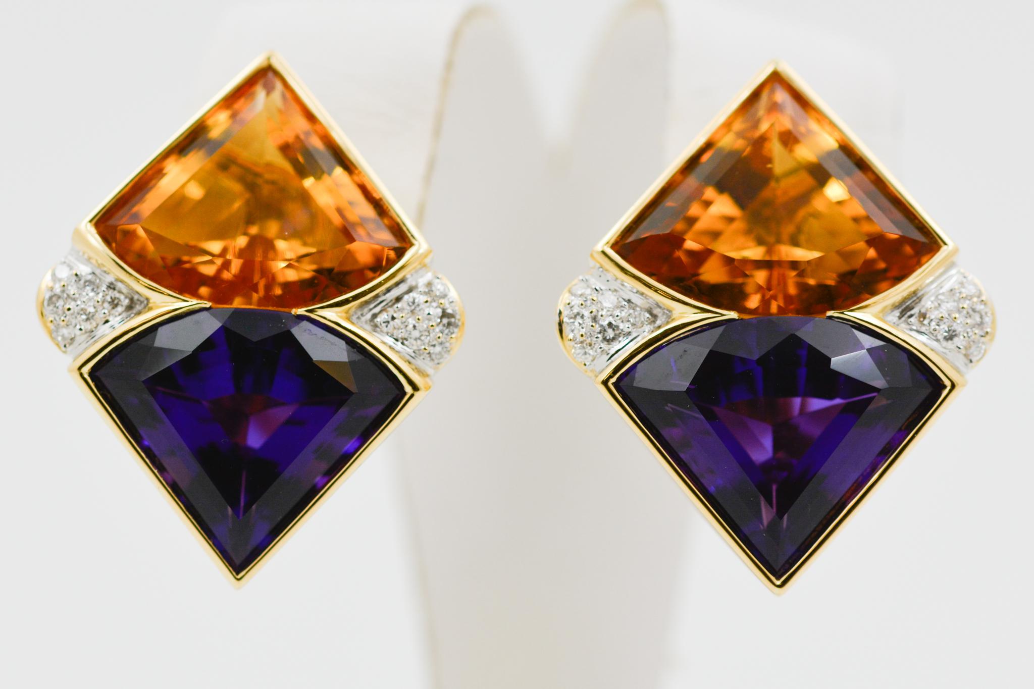 These 18 karat yellow gold diamond shaped earrings feature two citrines, weighing 24.00 carats, and two amethysts, weighing 24.00 carats. They are accented by 24 round brilliant cut diamonds weighing a combined 0.36 carats with H-I coloring and SI