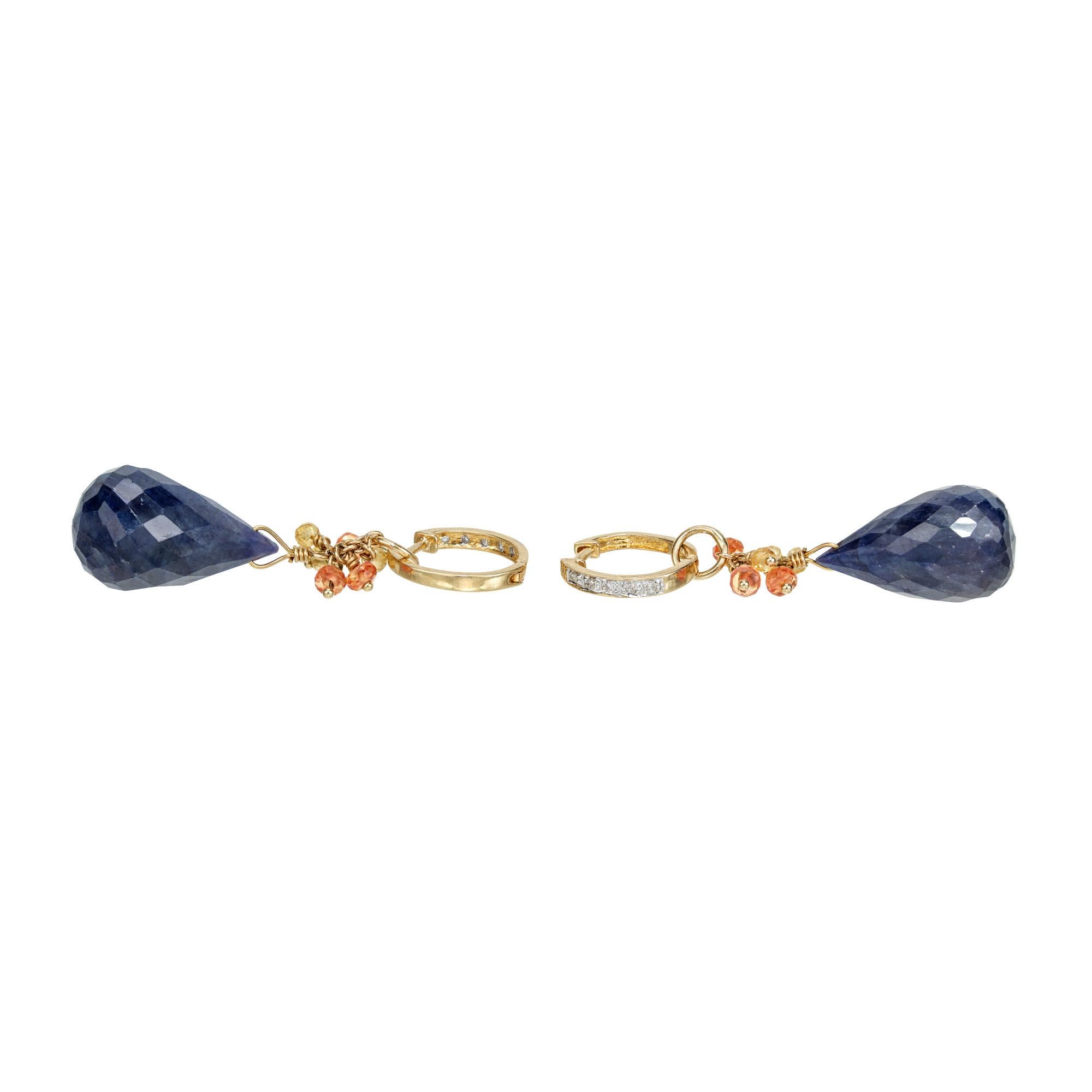 Deep blue sapphire and diamond dangle earrings. 2 rich blue briolette sapphires totaling 24.00cts, accented with 12 orange and yellow bead sapphires, that dangle from two diamond 14k yellow gold hoops. Day and night style earrings. The dangles can