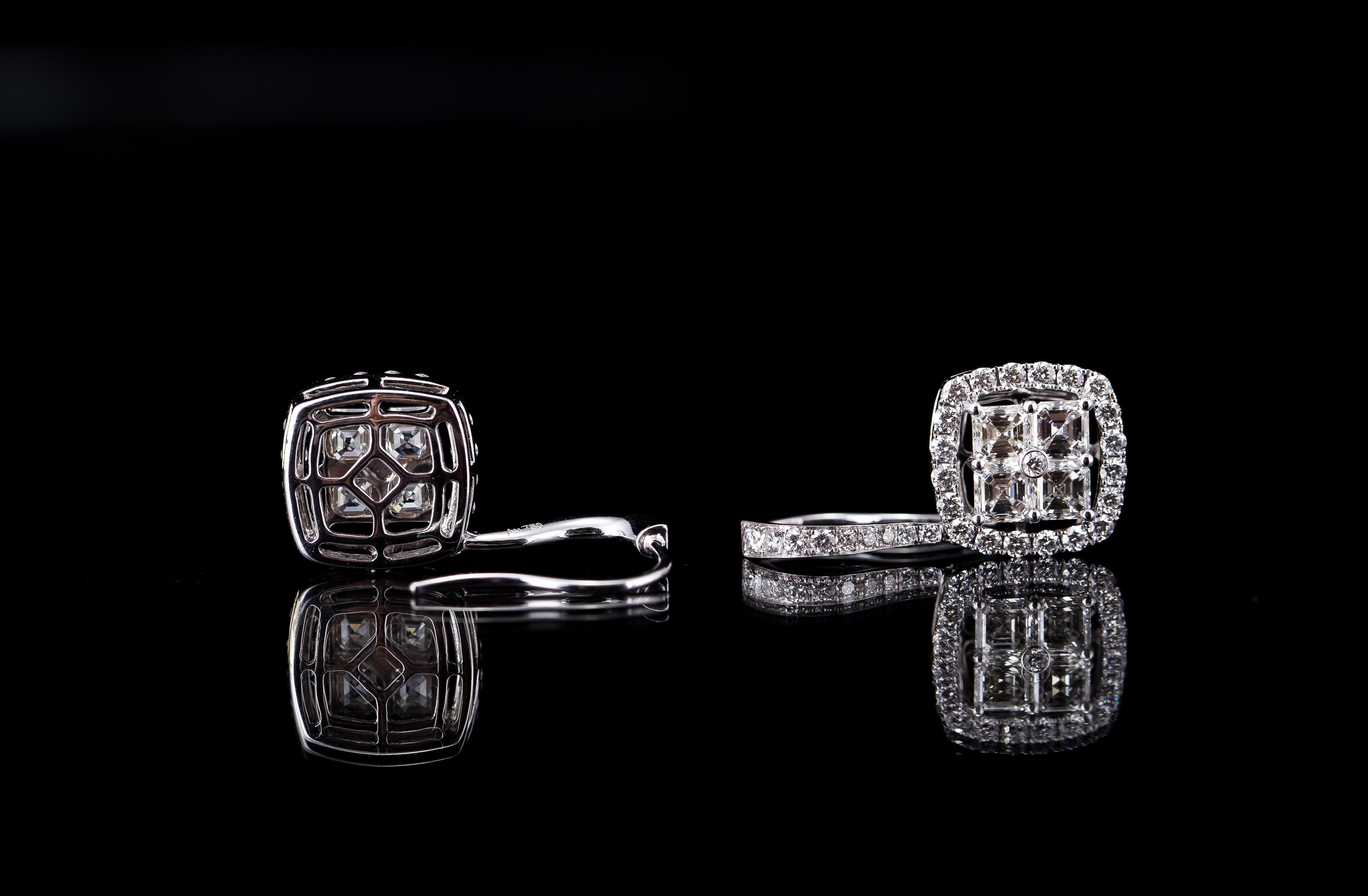 These cute earrings, each have four asscher cut diamonds as their center piece. 