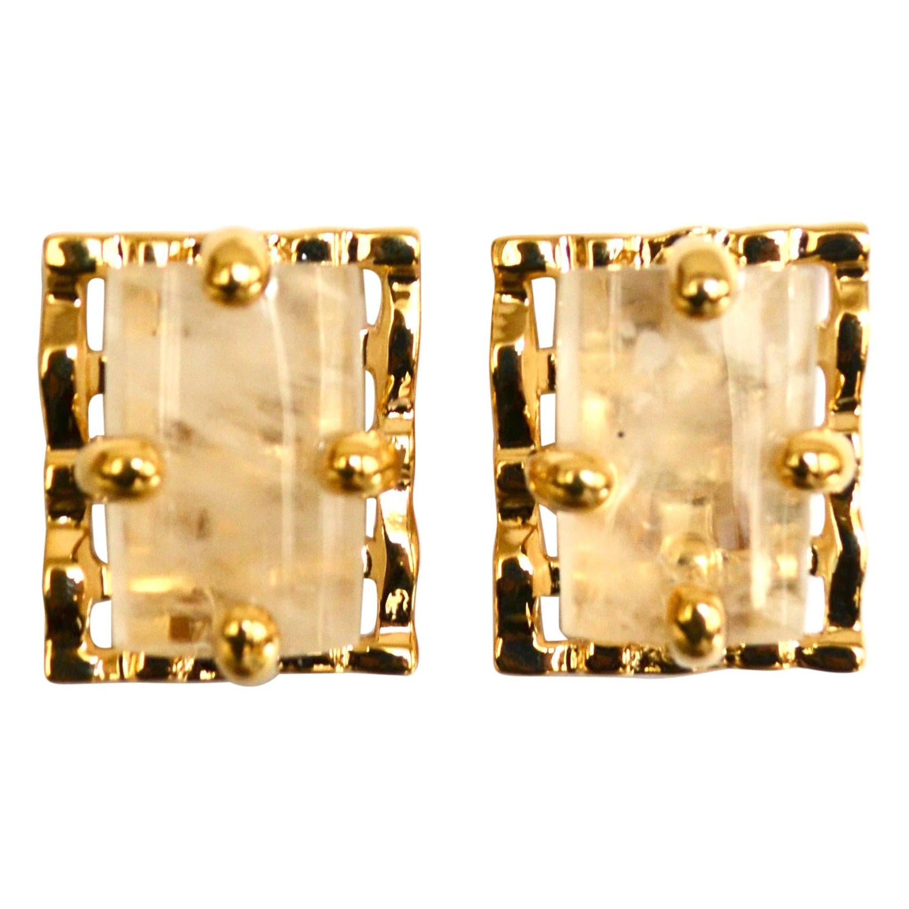 Rectangular rock stones set on 24-carat gilded bronze clip earrings.
This designer was Robert Goossens personal assistant in all of his creations. She worked by his side for 20 years creating collections for Yves St Laurent and many more couture