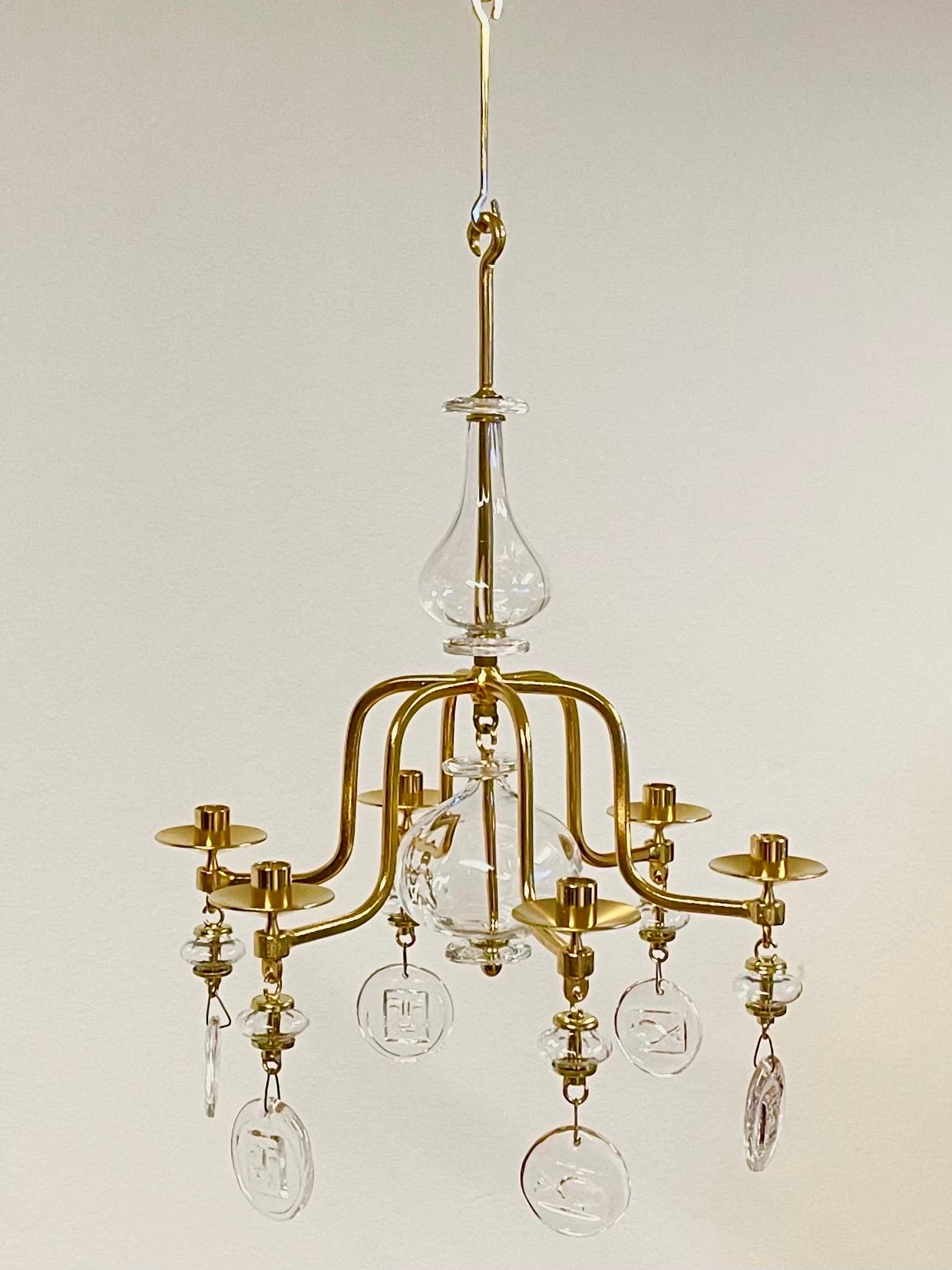This is the Swedish forged, six-armed gilded candle chandelier, designed by Erik Höglund for Boda Glasbruk.
This model is one of several, both in gilt and bare steel, designed in the 1960s. Only a few models were produced with gilding.

This