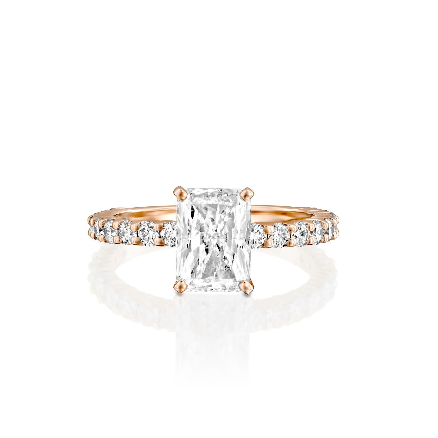 This impressive ring features a solitaire GIA certified diamond. Center stone is 100% eye clean natural, radiant shaped 1.5 carat diamond of F-G color and VS2-SI1 clarity and it is surrounded by smaller natural round diamonds of 0.90 total carat