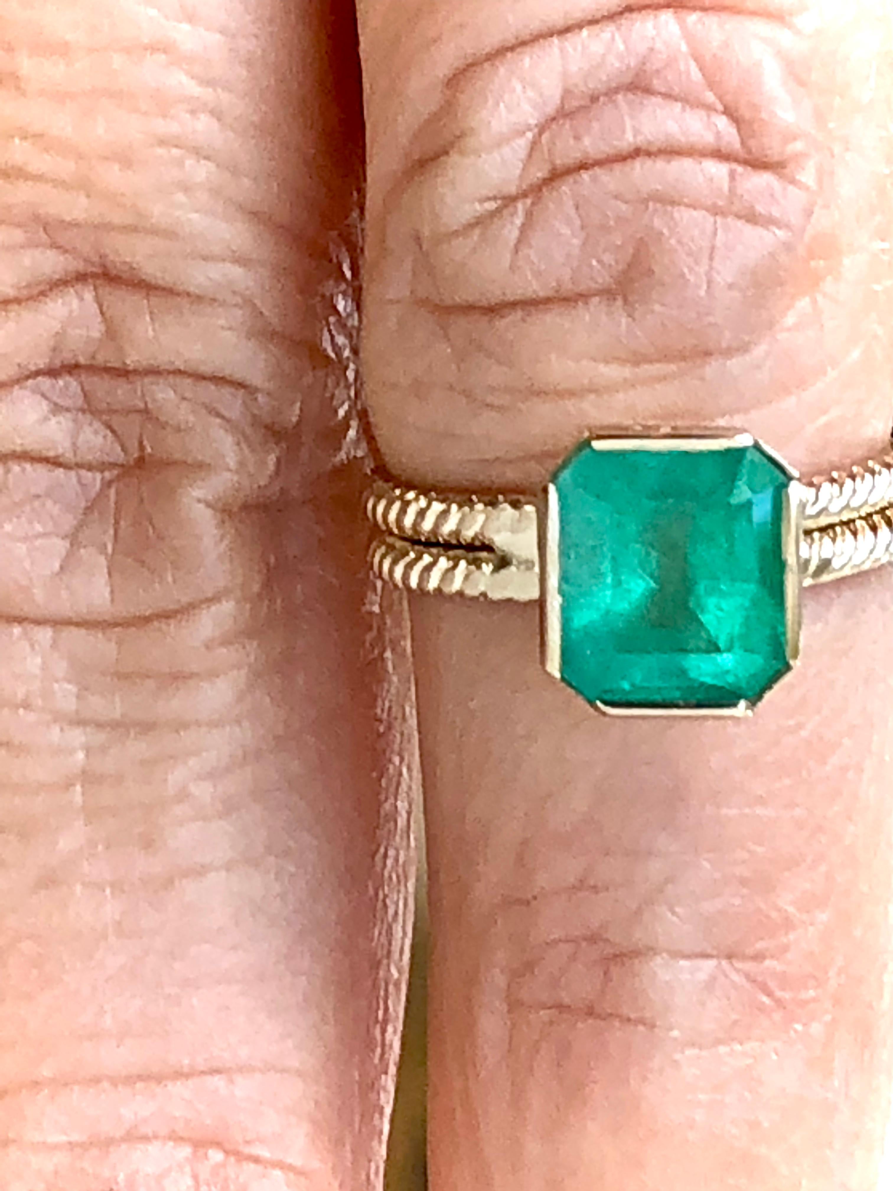 Natural Colombian Emerald emerald cut vintage solitaire ring 14 K yellow gold 
Emerald approx. weight 2.40 carats, the emerald measurements are 8.40mm x 7.42mm. Natural Medium Green, SI clarity.
Size: 6
Setting:  Semi-bezel 
Estate- Very Good