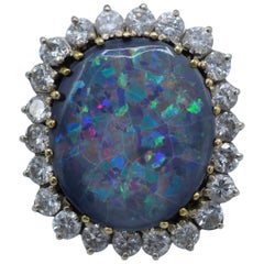24 Diamond and One Black Opal Ring