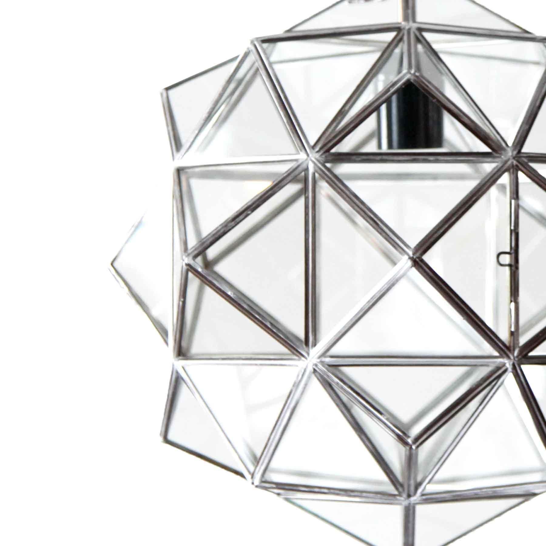 These glass lanterns are made in a generations-old workshop in Granada, Spain. Each pendant light is hand forged, and reflects the influence of Moorish design that can be observed throughout the region.

With their multitude of diamond-shaped panes