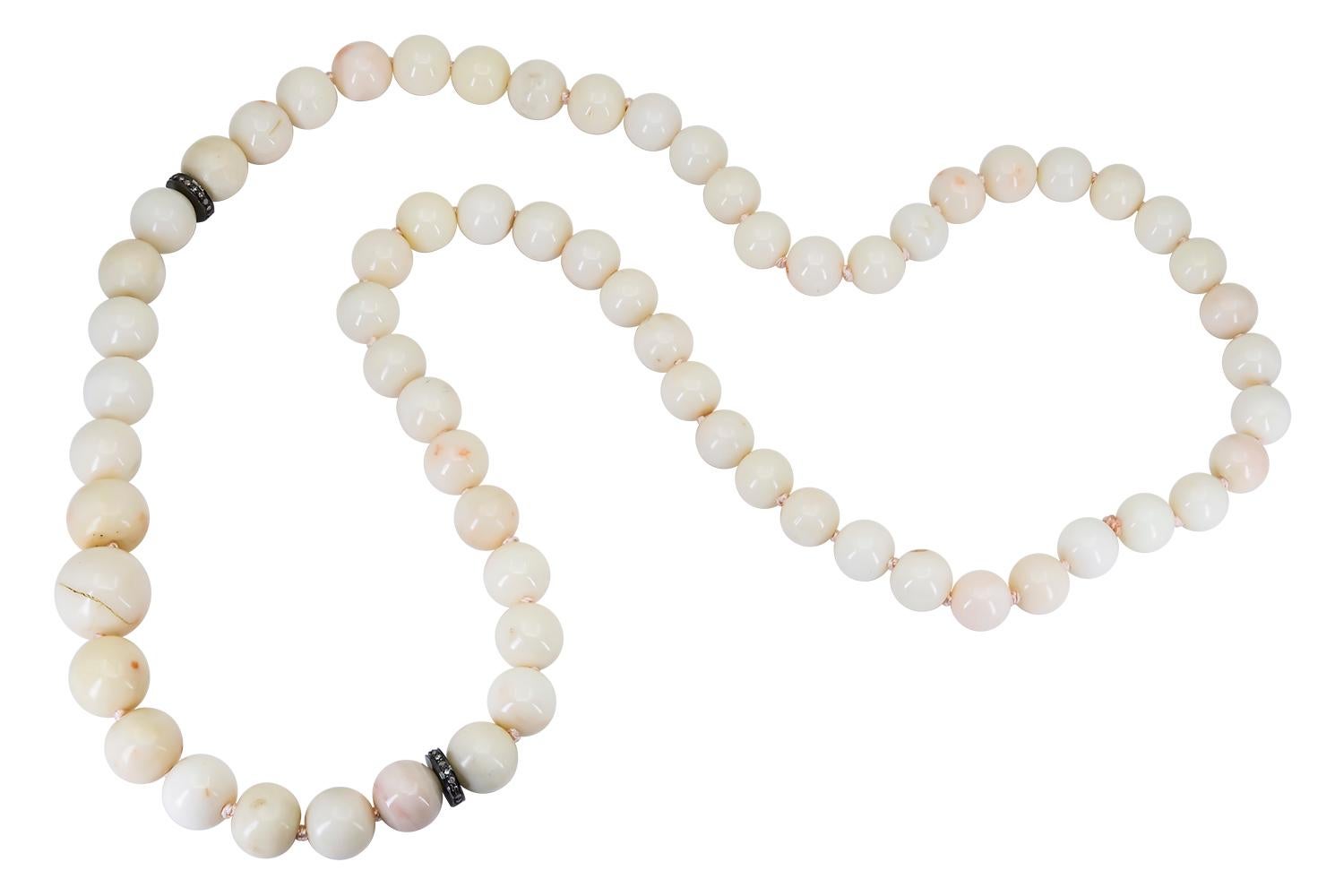 These White Coral beads were purchased as part of an estate before being made into this classic 24 inch graduated hand strung White Coral Necklace with sizes that range from
 8.5 - 13.5 mm each. These Natural Ocean Gems are separated by 2 Rhodium