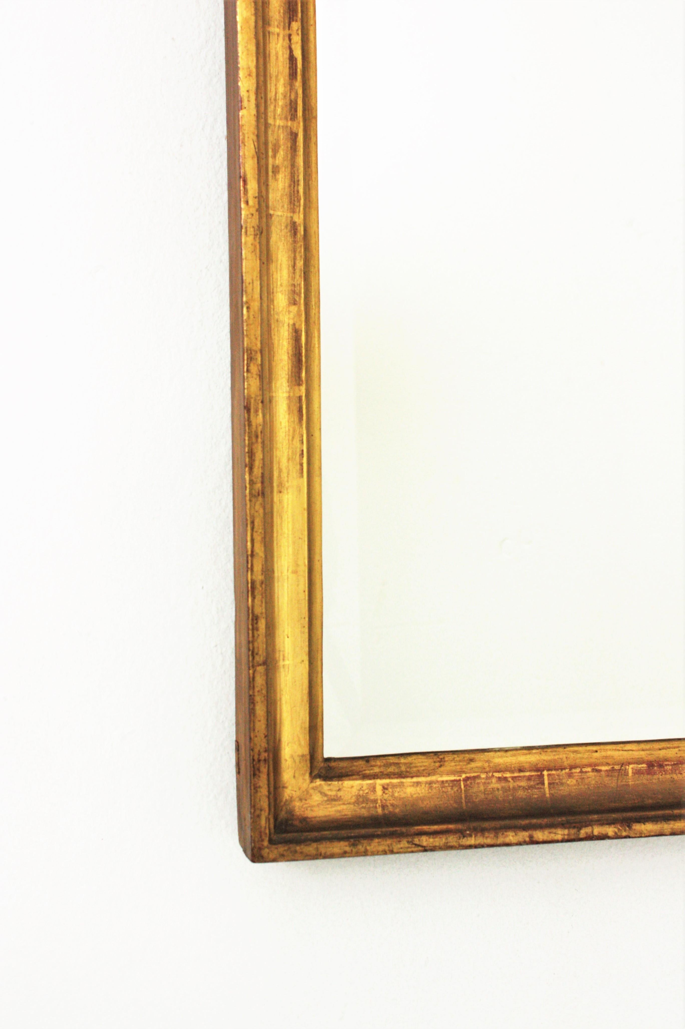 Spanish 24-Karat Gold Leaf Giltwood Empire Beveled Mirror For Sale