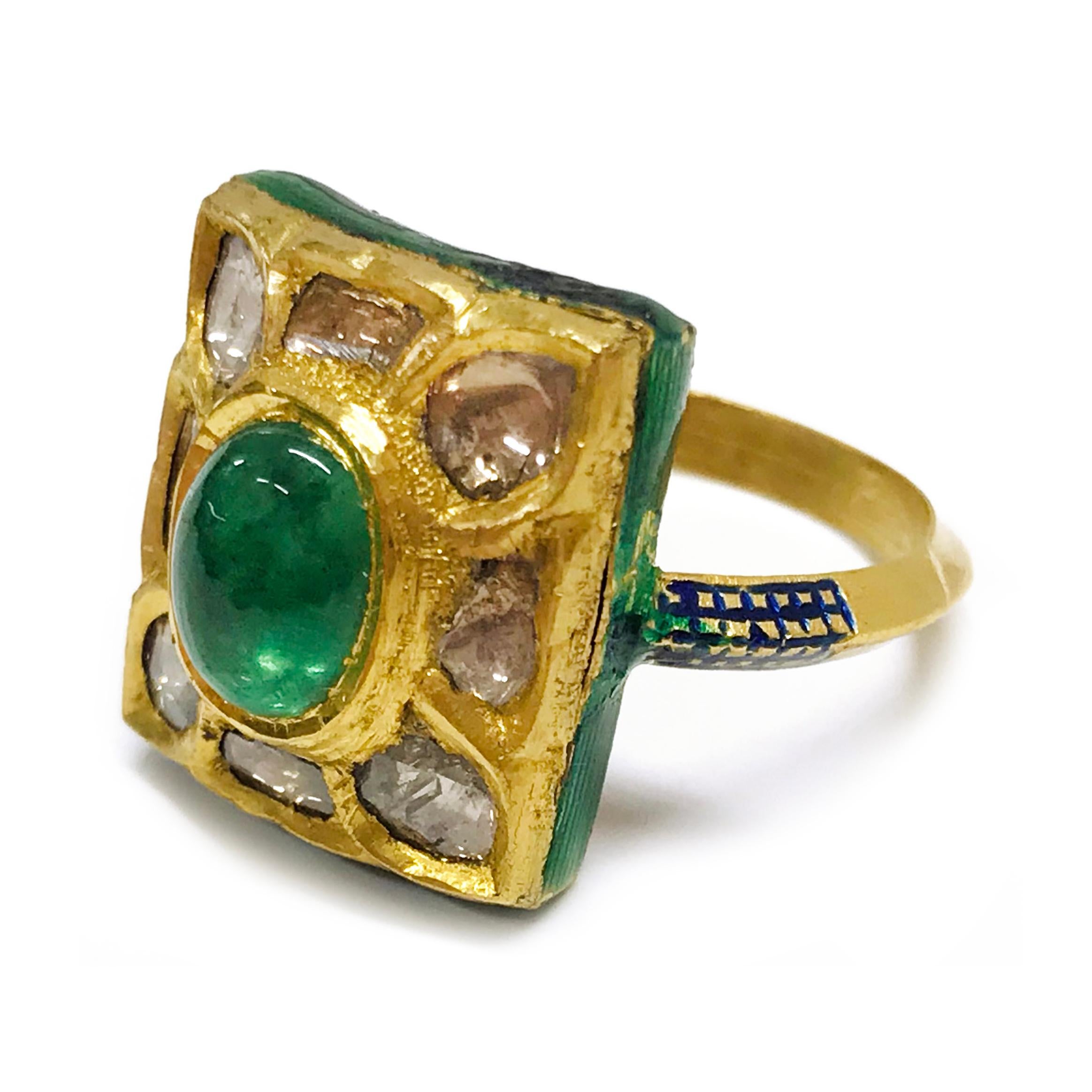 24 Karat Diamond Emerald Enamel Ring. This unique Kundan ring features an oval emerald cabochon at the center with eight Indian-cut/Polki diamonds and enamel accents. There are enamel accents of green and blue on the sides and on the top of the