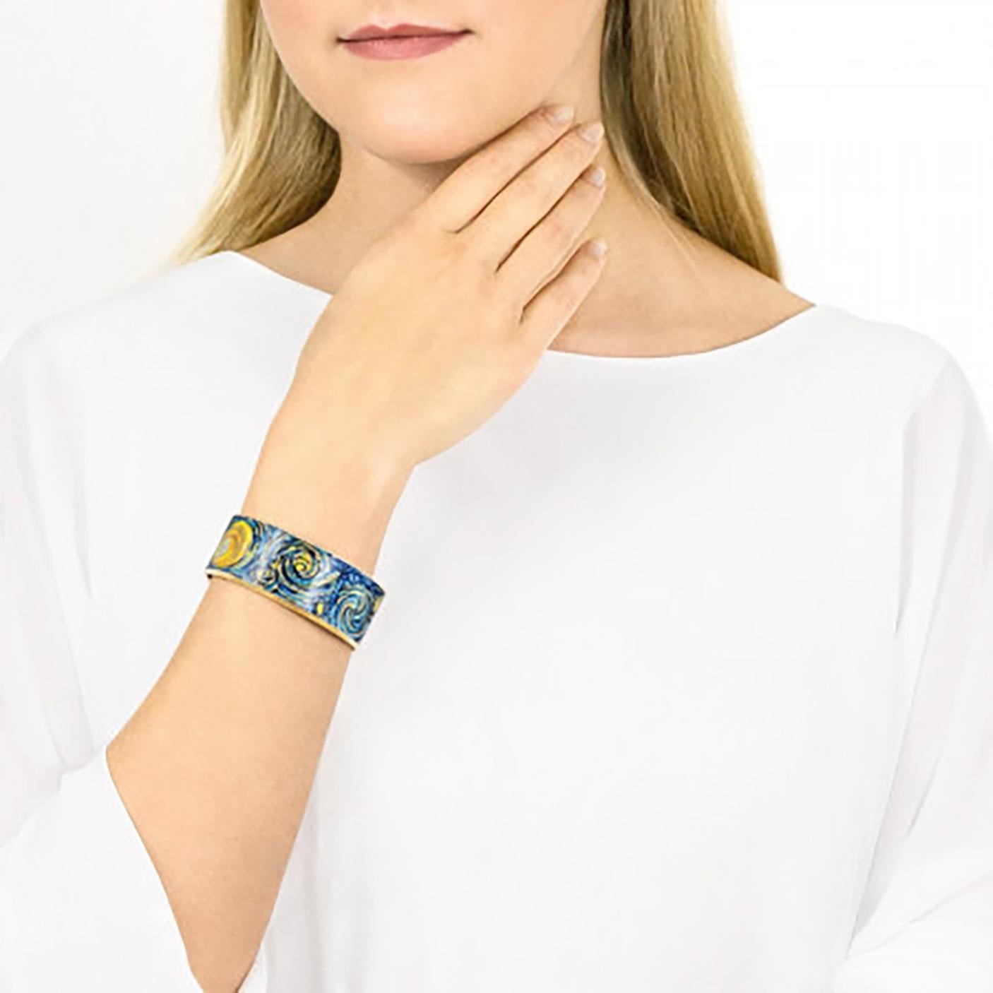 The Bangle that slides on. Fits a medium wrist. 
Paying hommage to Van Gogh the fired enamel inspired by Eternite [Starry NIght] . 

Recommend:
Store it separately from your other jewelry
Take it off before washing your hands