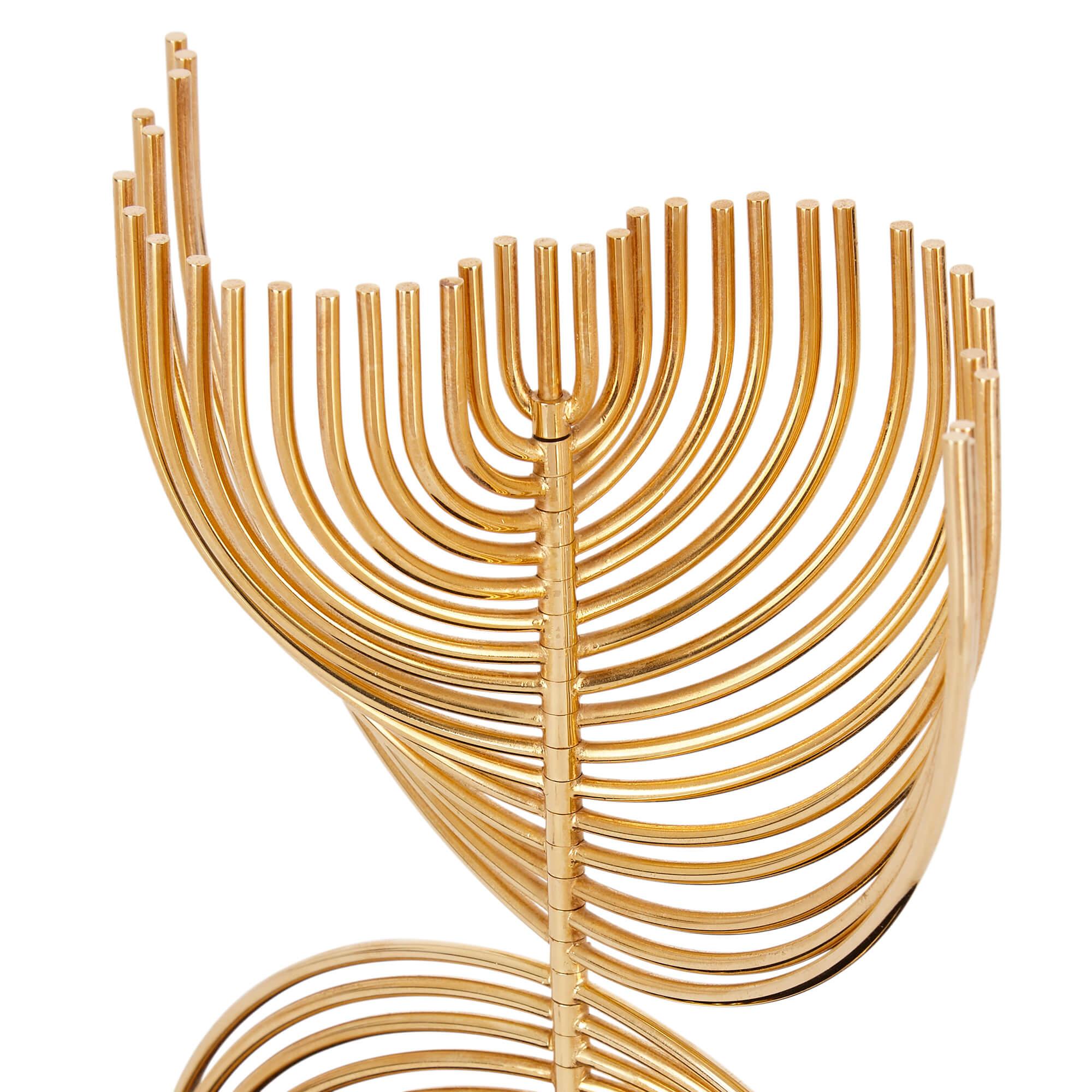 Kinetic 24 karat gold plated menorah sculpture by Yaacov Agam