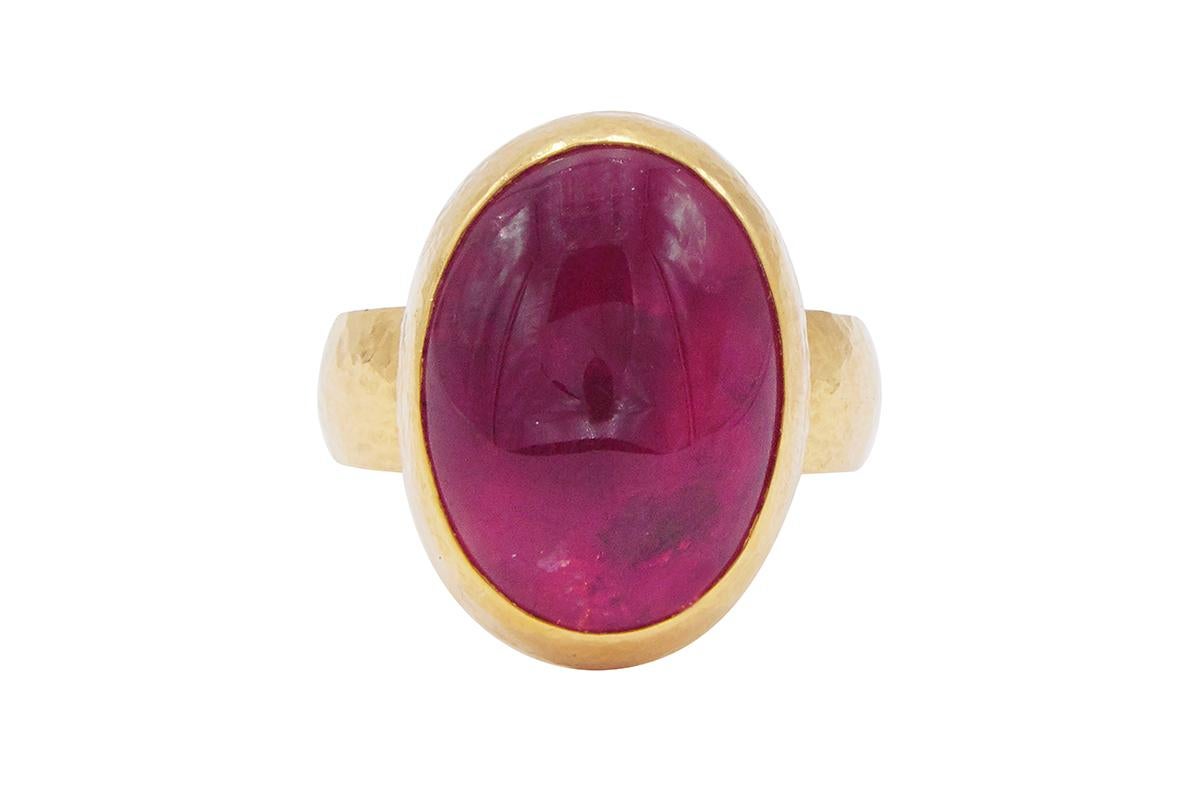 GURHAN one-of-a-kind cocktail ring set in 24 Karat hammered yellow gold featuring a 19x14mm oval cabochon Pink Tourmaline, 19.15 cts. Bezel, vertical stone setting with graduated shank, size 6.5.