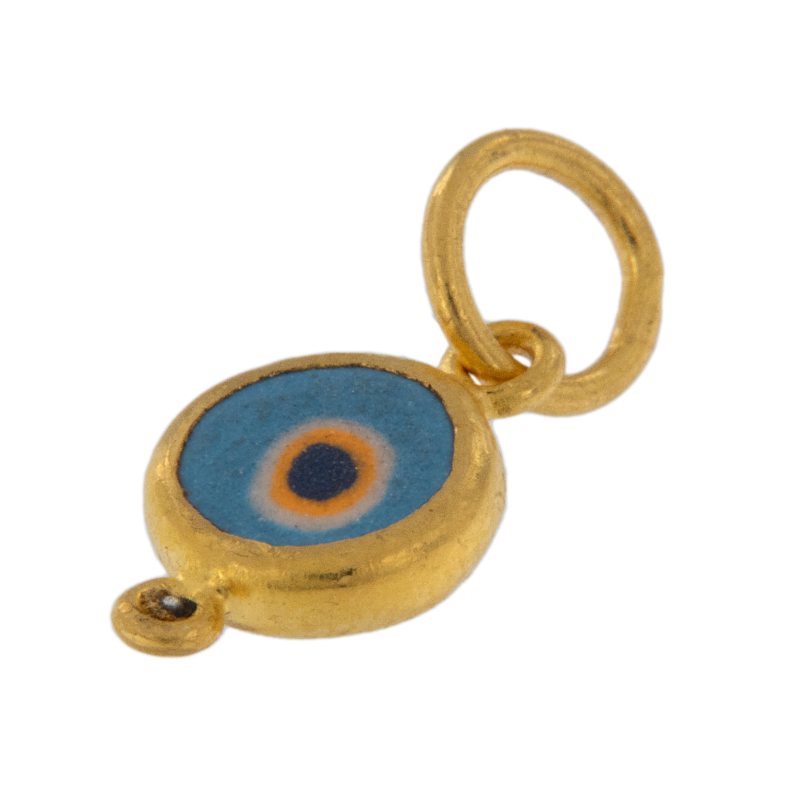 Rarest of all the golds, 24 karat gold is valued by all discerning investors. With it's unmistakable warm yellow color & hammered finish with diamond accent this evil eye pendant / charm talisman is thought to keep you safe from curses. Light Blue:
