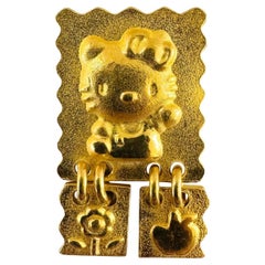 Ciondolo a forma di charme di Hello Kitty in oro giallo puro 24 carati