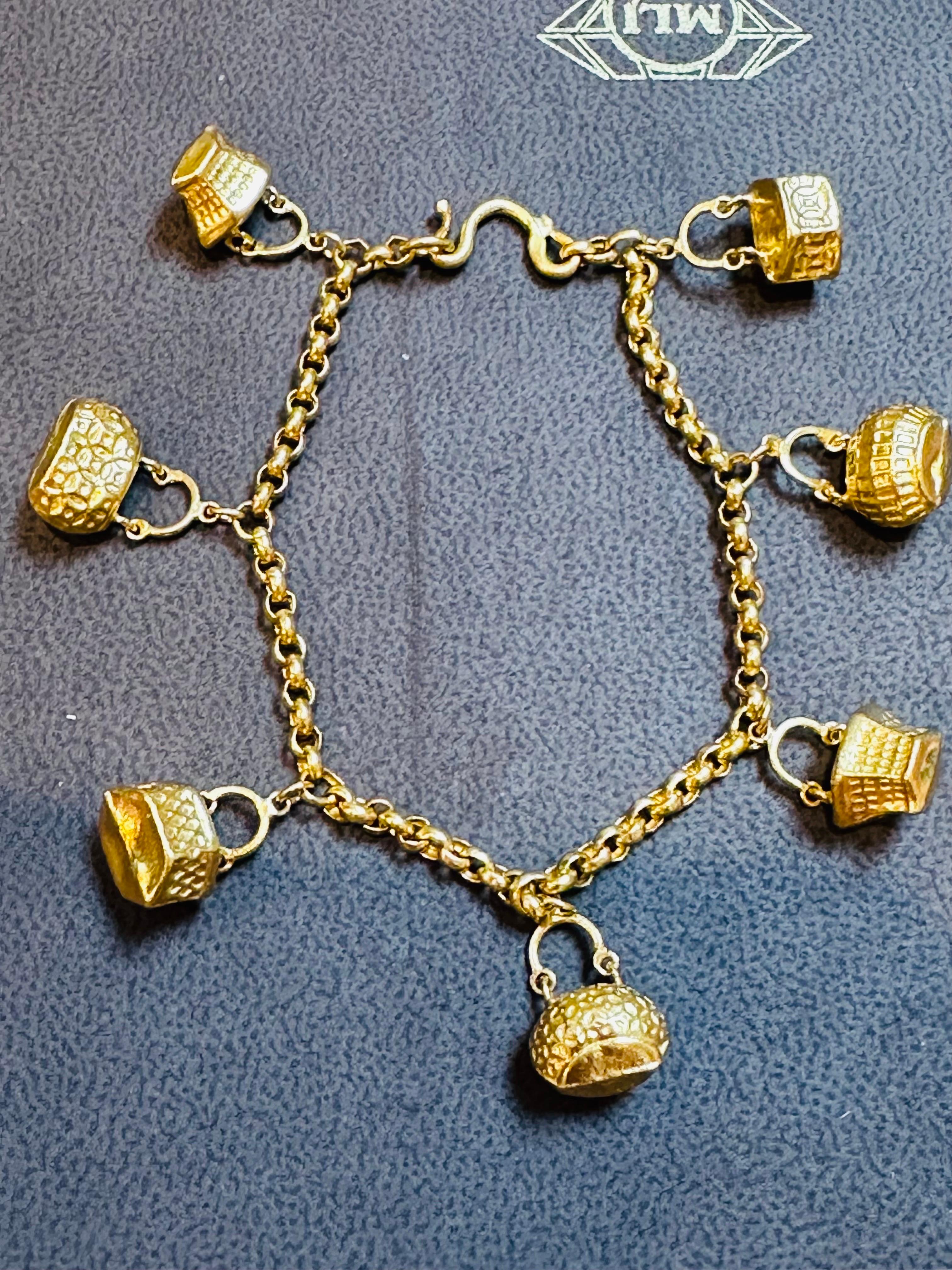 24 Karat Yellow Pure Gold 15.5 Gm Charm Bracelet with 7 Basket Charms In Excellent Condition For Sale In New York, NY