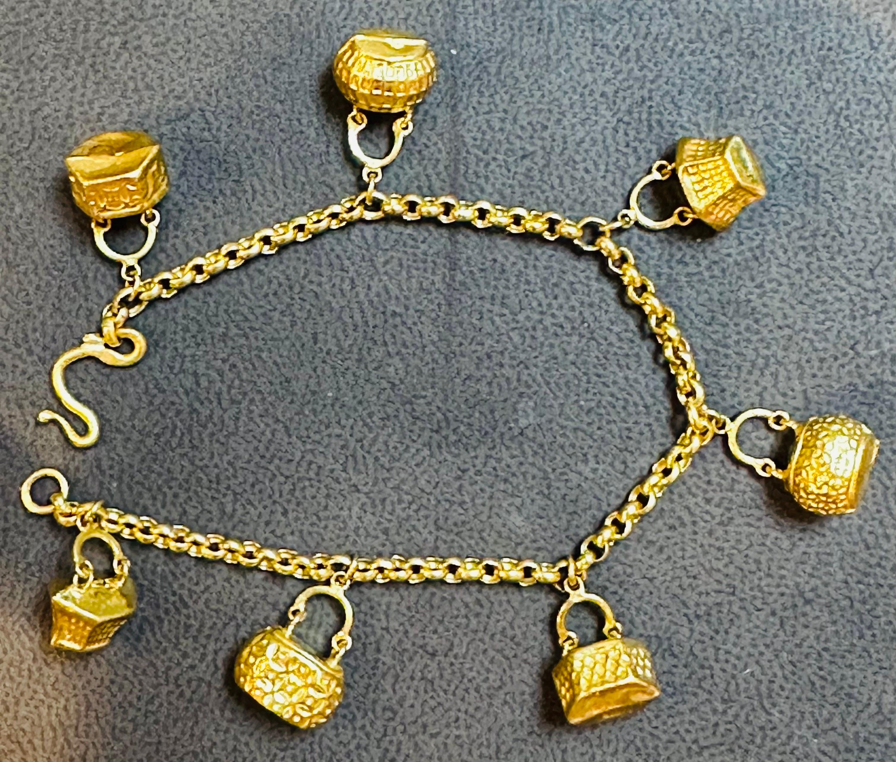 Women's 24 Karat Yellow Pure Gold 15.5 Gm Charm Bracelet with 7 Basket Charms For Sale