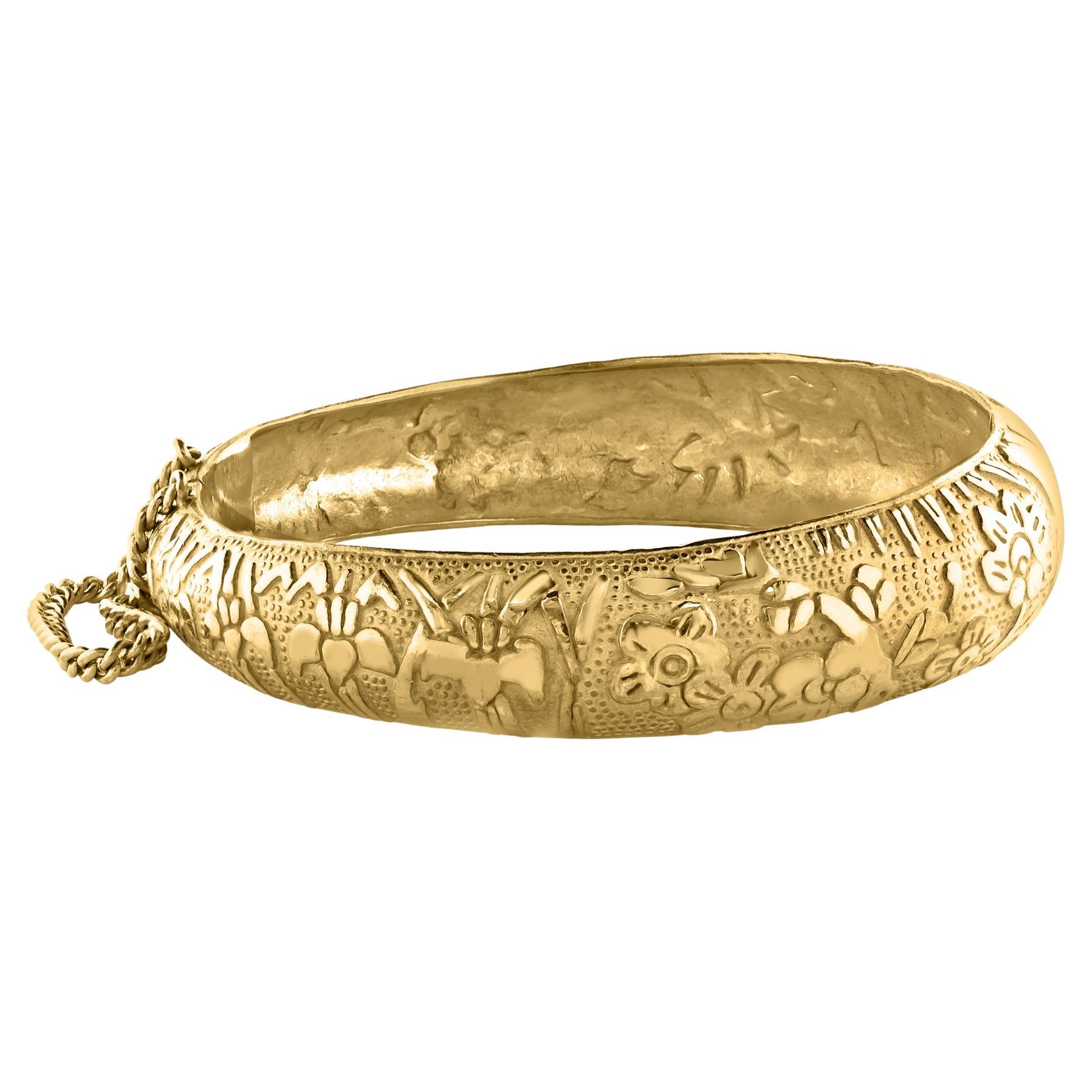 This 24 karat yellow gold Bangle  bracelet is a stunning piece of jewelry crafted from authentic solid gold. The Bangle  bracelet weighs 75.1 grams and measures 2.8 inch inside circle , making it a substantial and valuable addition to any