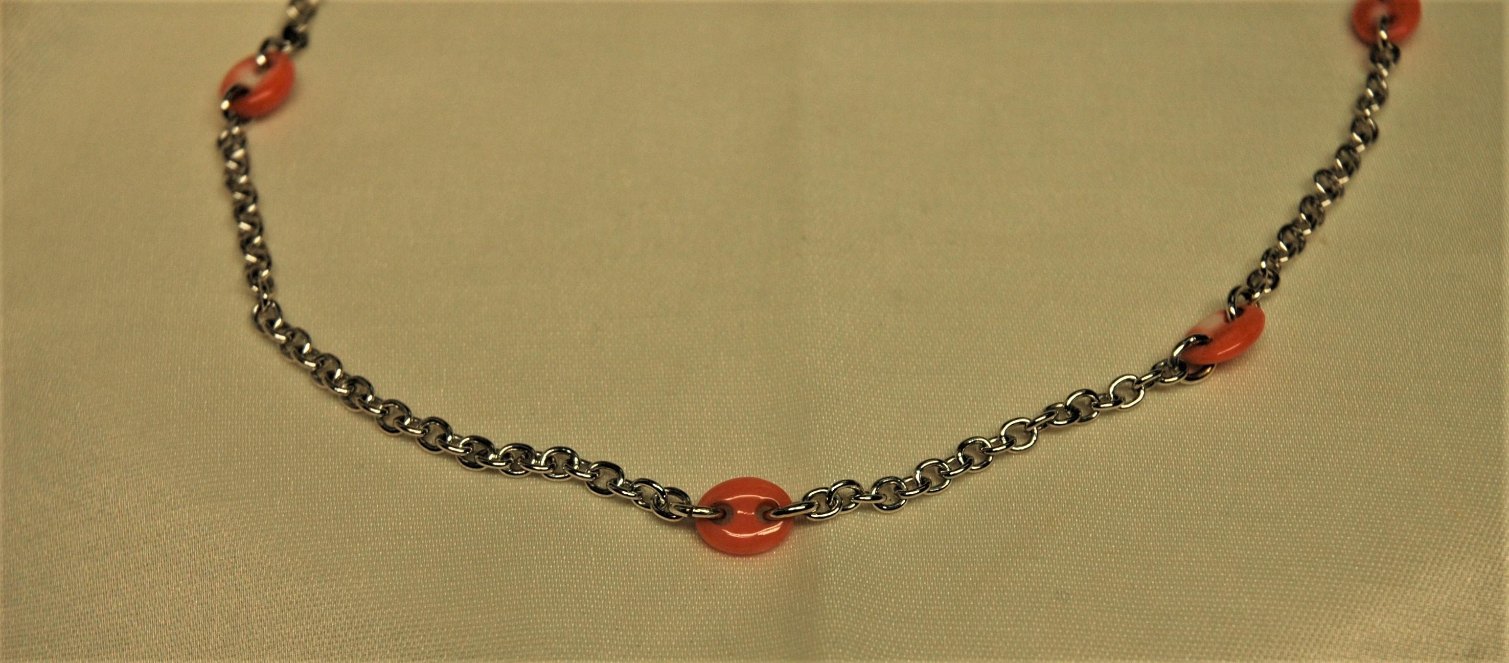 Special white gold chain necklace. It has six natural coral elements and it is 47 cm. long. The total weight is 18.4 g. It's Italian manufacturing made in the city of Torre del Greco, near Naples. This place is very famous for the manufacturing of