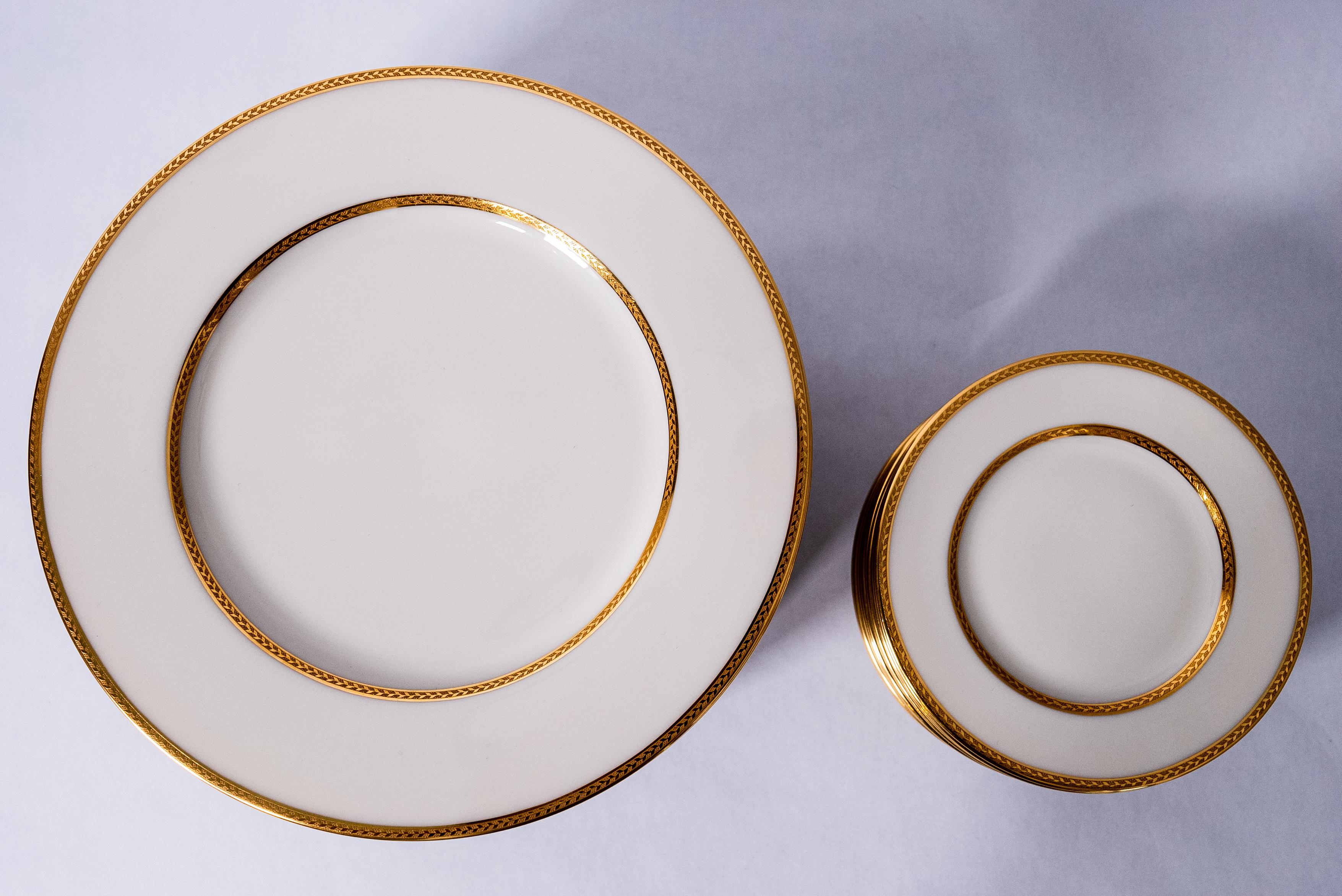 From one of America's oldest porcelain manufacturers i this custom ordered grouping from the fine Gilded Age Retailer of Marshall Fields Chicago. This set features 12 generous dinner plates and 12 side or bread plates. Crisp white porcelain and