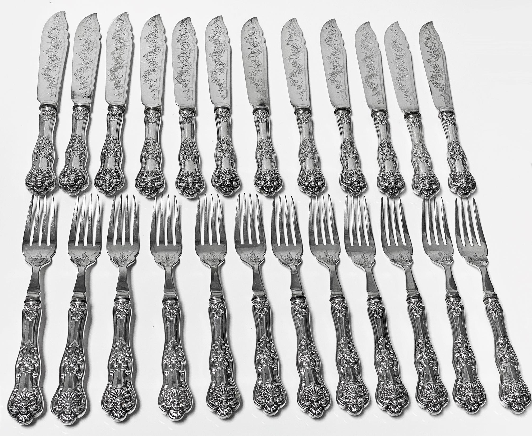 24-piece Sterling Silver Queens Pattern Fish Set C.1920. Set comprising 12 Fish Knives and 12 Fish Forks. All handles stamped Sterling, blades, and tines silver plate. Queens pattern handles, the blades and tines engraved foliage decoration. Lengths