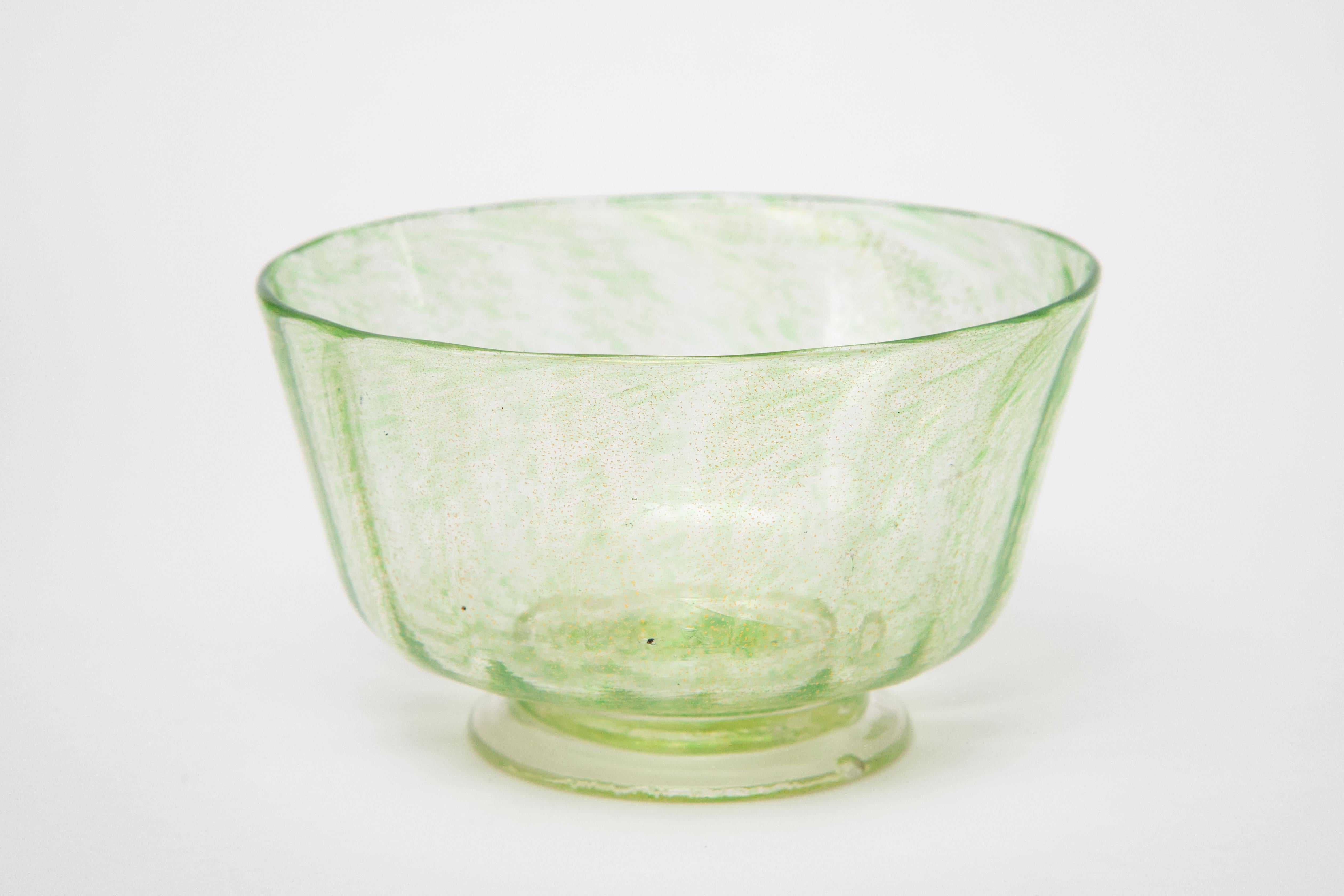 A pretty set of 12 Venetian Green Glass Bowls with 24 karat blown gold inclusion with 12 matching plates to go underneath. Classic and elegant, these pieces will mix and match in nicely with all your fine tabletop. Beautifully crafted and just the