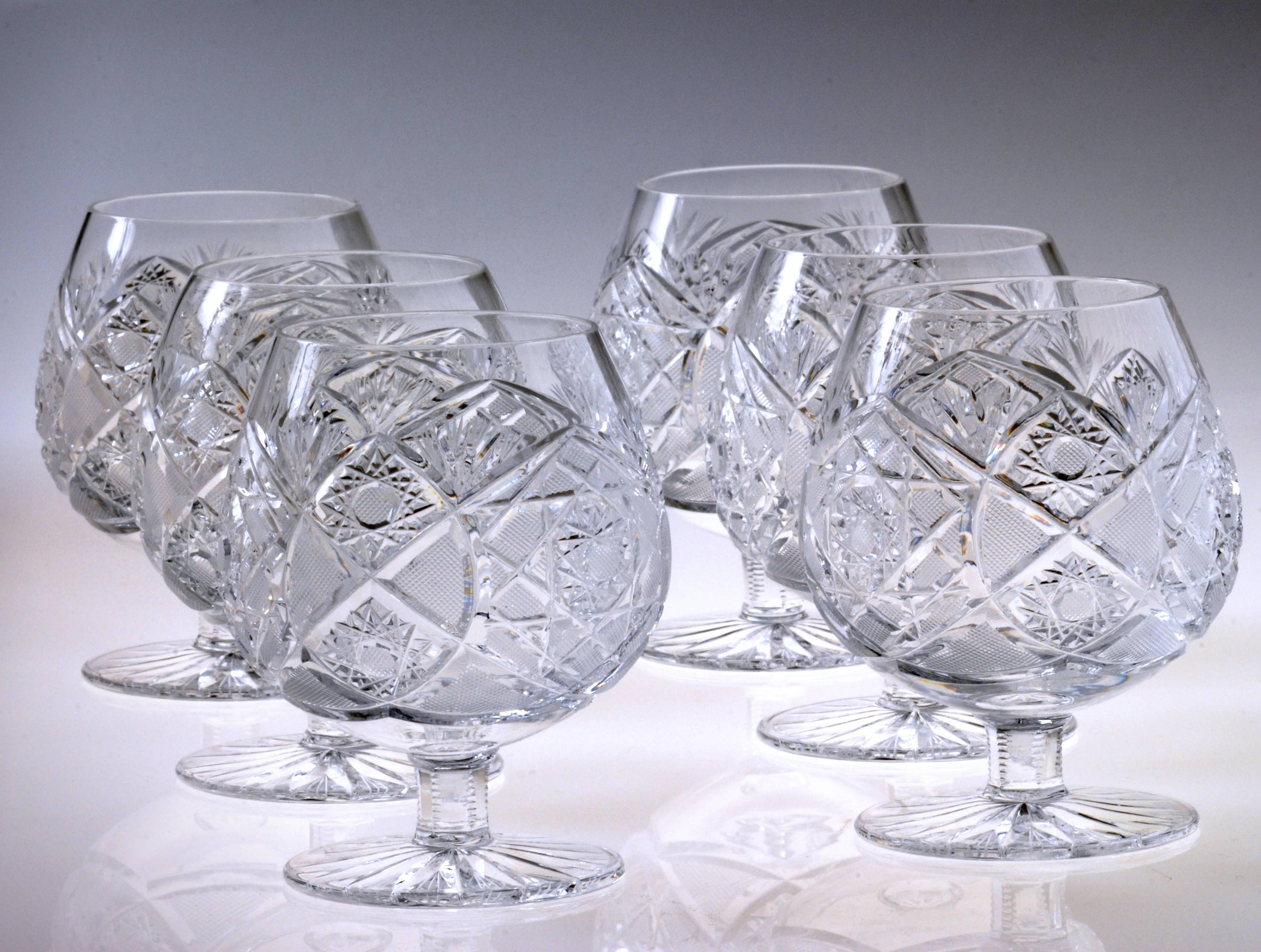 A beautiful glass drinking set by Moser, manufactured in the Czech Republic, circa 1960.

These eye-catching pieces are no longer in production, and therefore a very rare find. This is a complete set, containing four champaign glasses, four