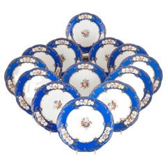 Antique Set of twenty four blue and white floral porcelain dinner plates