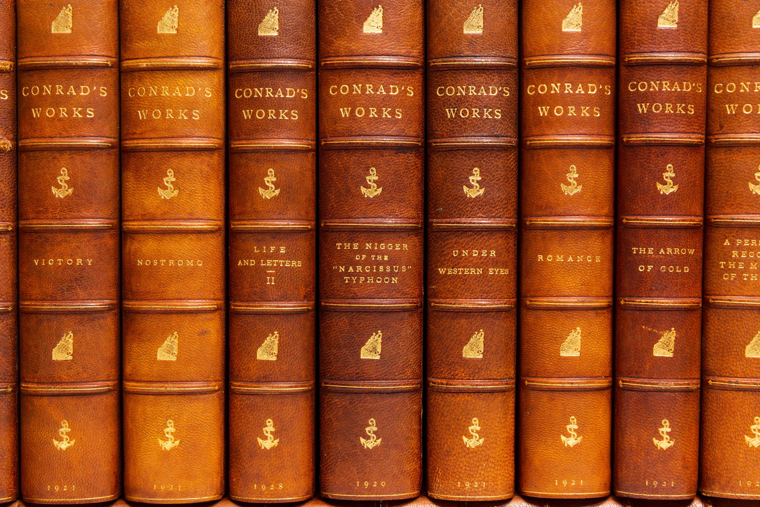 24 Volumes. Joseph Conrad, The Works of Joseph Conrad. Bound in 3/4 brown morocco. Linen boards. Raised bands. Top edges gilt. Decorative gilt emblems on spines. Marbled endpapers. This Sun-Dial Edition is limited to 735 copies. The first volume of