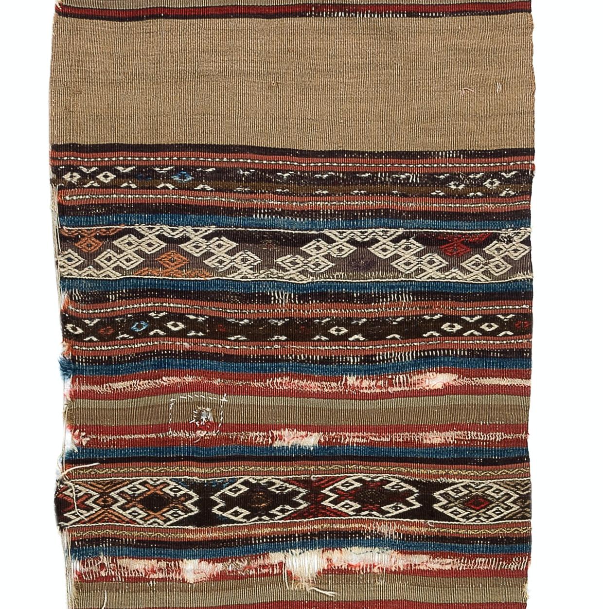 Embark on a journey through time and tradition with this exquisite Antique Anatolian Karapinar fragment distressed kilim, a rare artifact dating back to the 18th century. Crafted with meticulous skill and artistry by Anatolian weavers over three