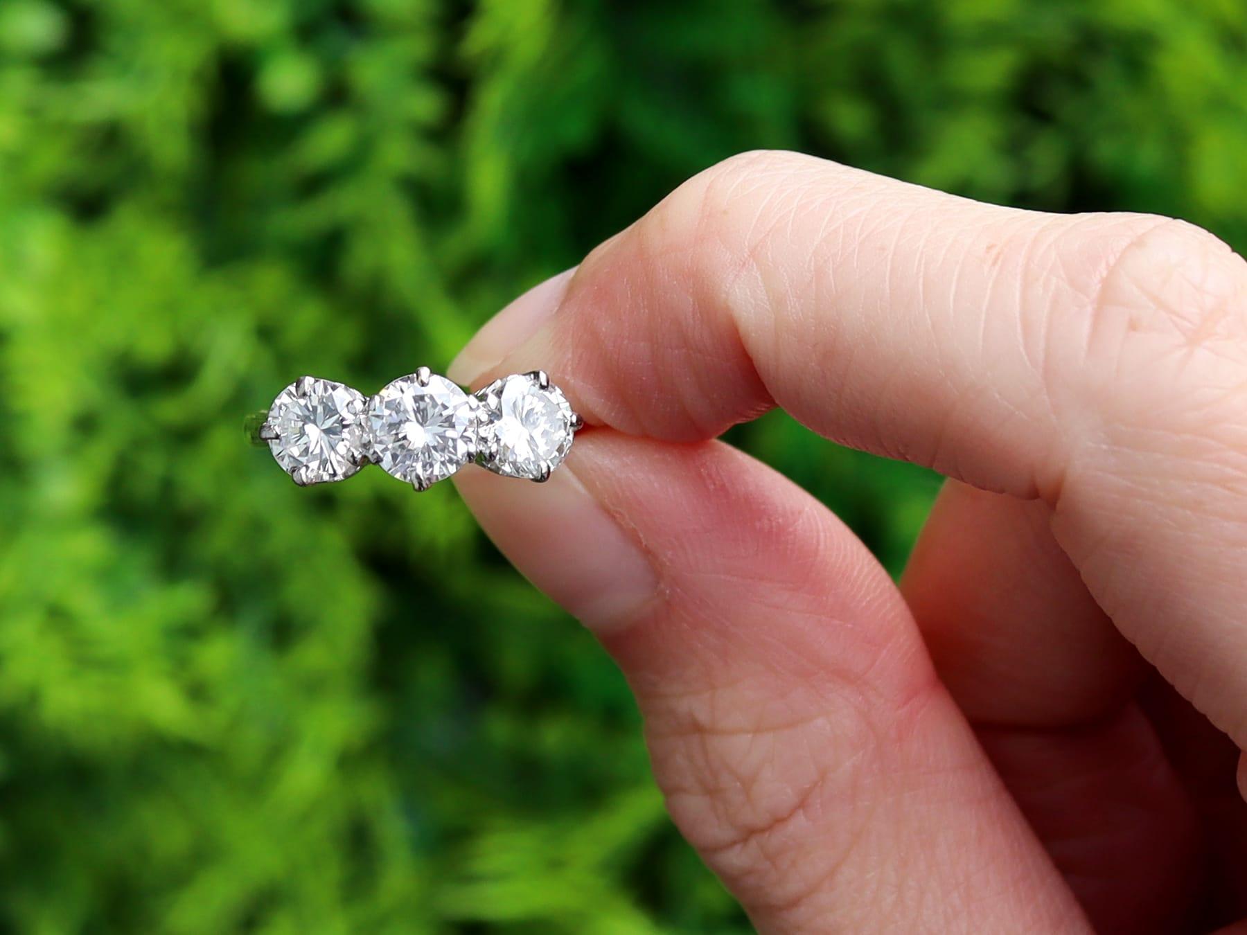 A stunning, fine and impressive vintage 2.40 carat diamond and 18l yellow gold, 18k white gold set trilogy ring; part of our vintage three stone engagement rings collection. 

This stunning vintage diamond trilogy ring has been crafted in 18k yellow