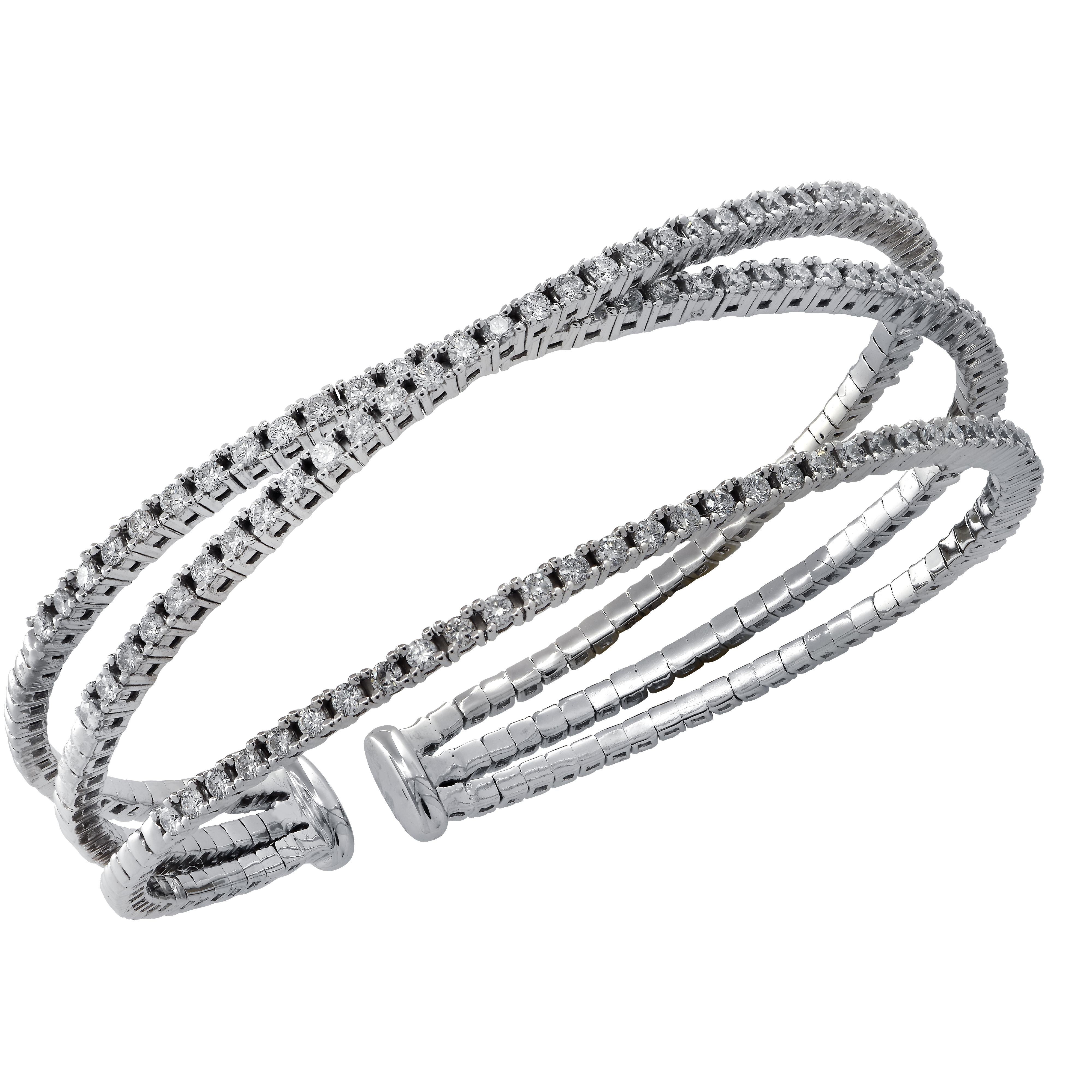 Stunning 3 row diamond cuff bangle bracelet crafted in White gold featuring 117 round brilliant cut diamonds weighing approximately 2.40 carats total, G color SI clarity. This bracelet has an inner circumference of 7.5 inches, and will fit wrist