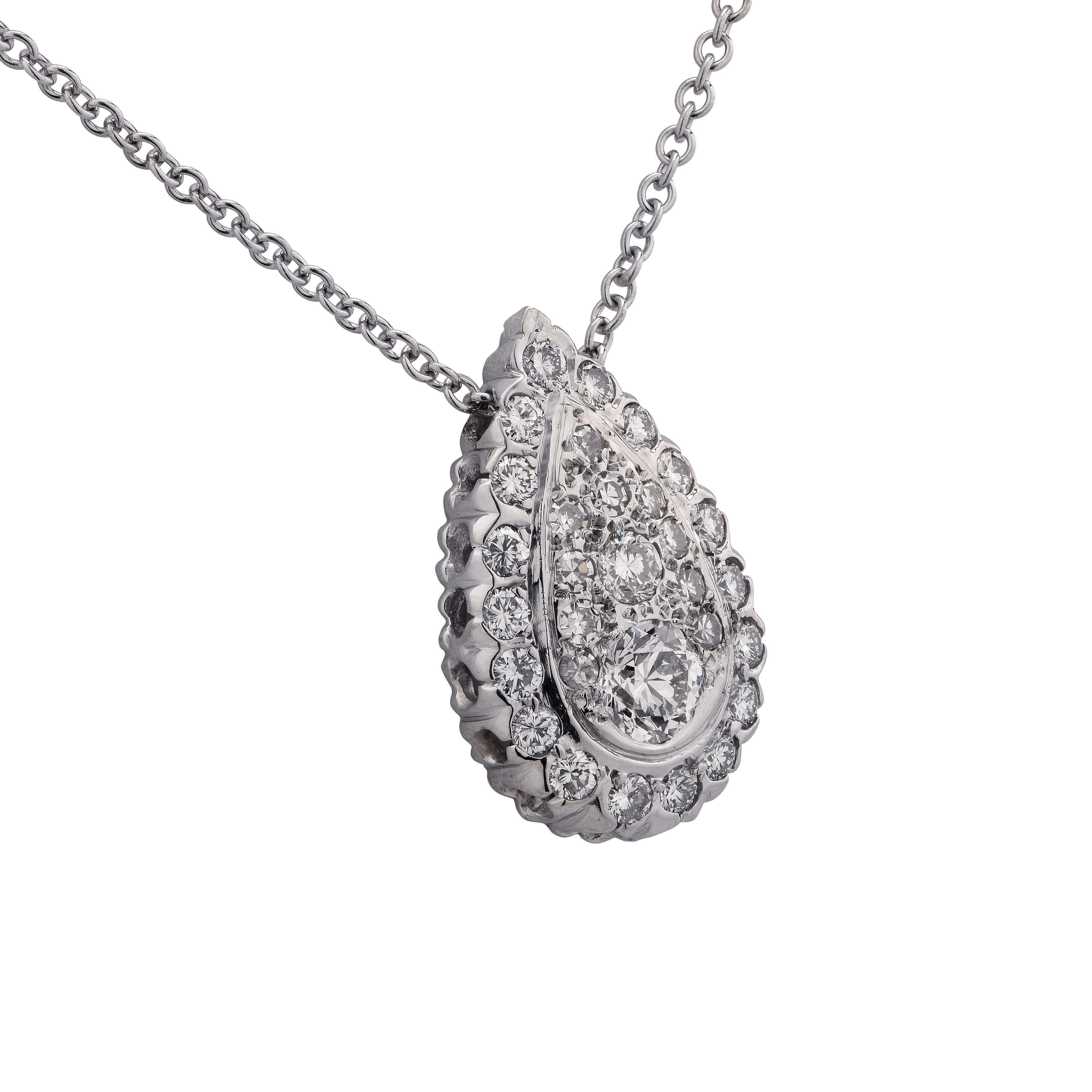 18K white gold necklace featuring a .70ct round brilliant cut diamond F color and VS clarity, surrounded by 29 round brilliant and single cut diamonds F color VS clarity set in a cluster pear motif. This beautiful necklace measures 1 inch long and