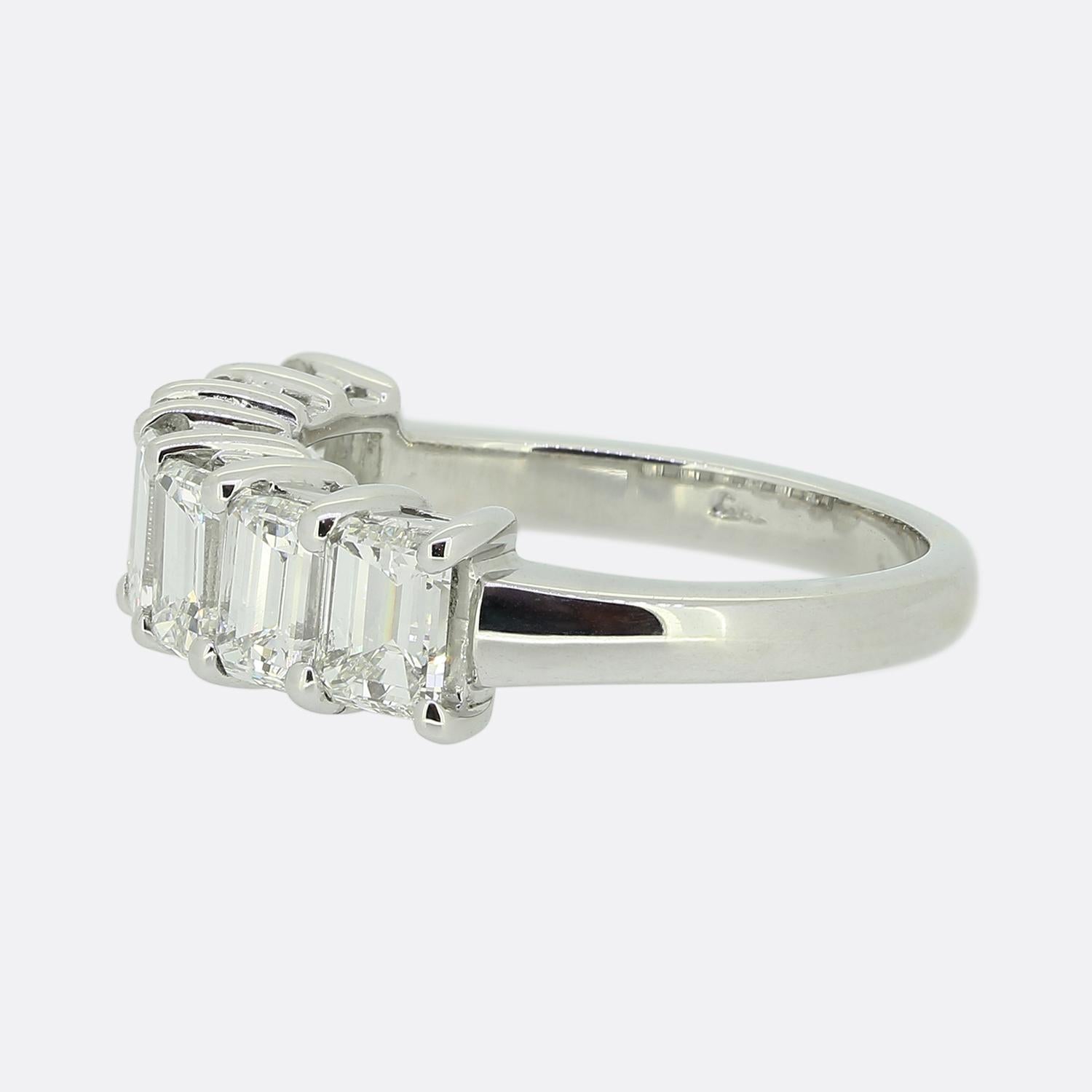 Here we have an outstanding seven-stone diamond ring. This timeless piece has been crafted from 18ct white gold and showcases seven wonderfully matched emerald cut diamonds in a single line formation. Each bright white stone has been individually