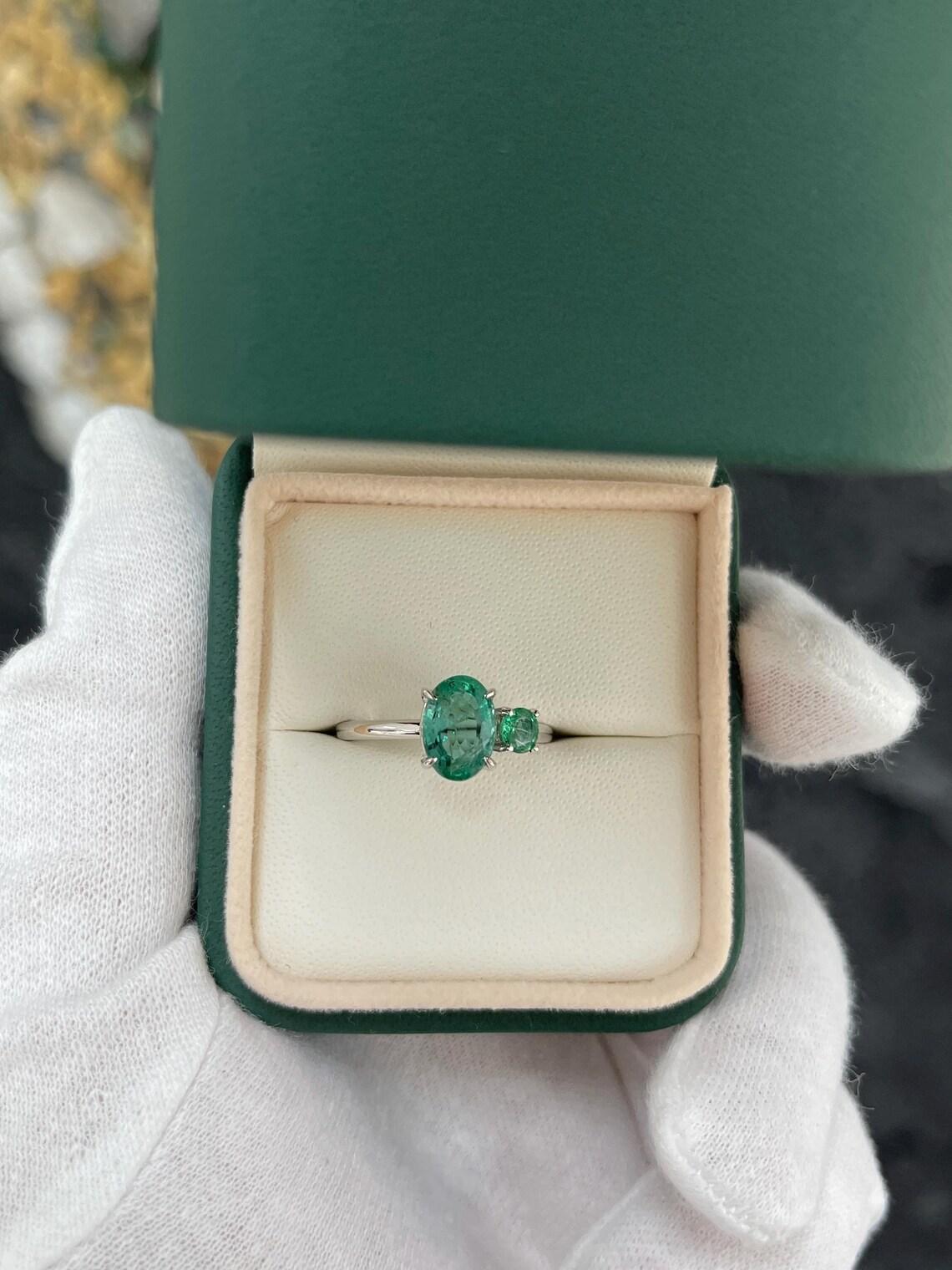 Modern 2.40 Carat Features Emerald With Oval And Round Cuts Toi Et Moi Ring For Sale