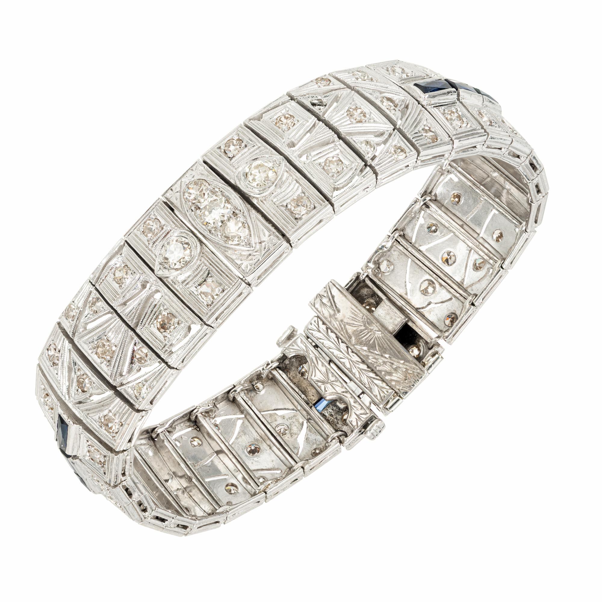 Very unusual 1940's Art Deco handmade diamond and synthetic bracelet. Set with 79 single cut light brown diamonds and 9 French cut synthetic blue sapphires in a filigree style silver bracelet. 7.25 inches in length. Double catch with an underside