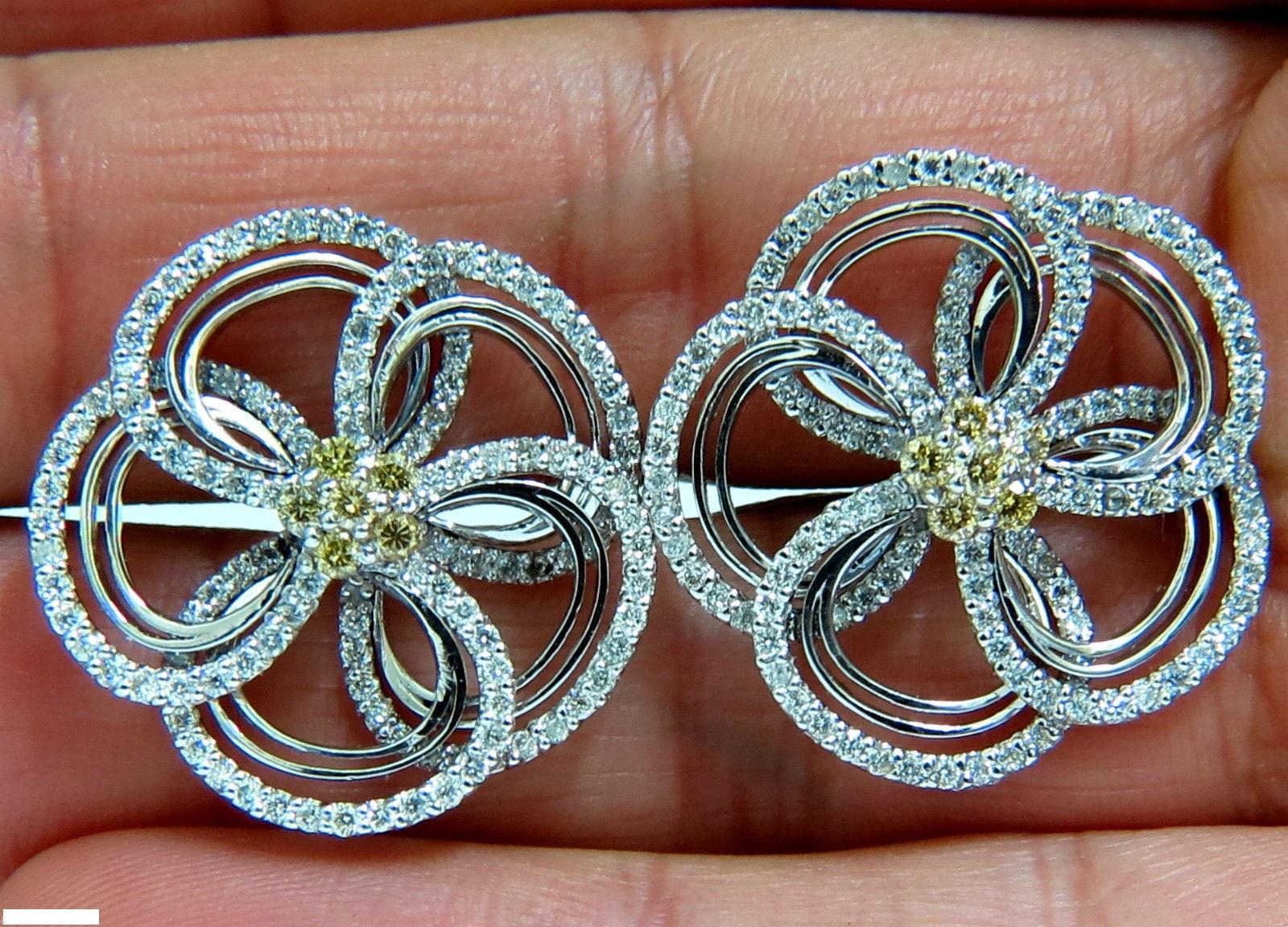 The 3D Crossover Floral Cluster:

Completely handmade



2.00ct. Natural Diamonds

Diamonds, Rounds, full cuts

H-color, Vs-2 clarity.



Additional .40ct. Natural Fancy Yellow diamonds.

Rounds, full cuts.

Vs-2 clarity.

Overall:

1 Inch