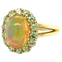 2.40 Carat Opal and Tsavorite Garnet Halo Cocktail Ring in 18k Yellow Gold