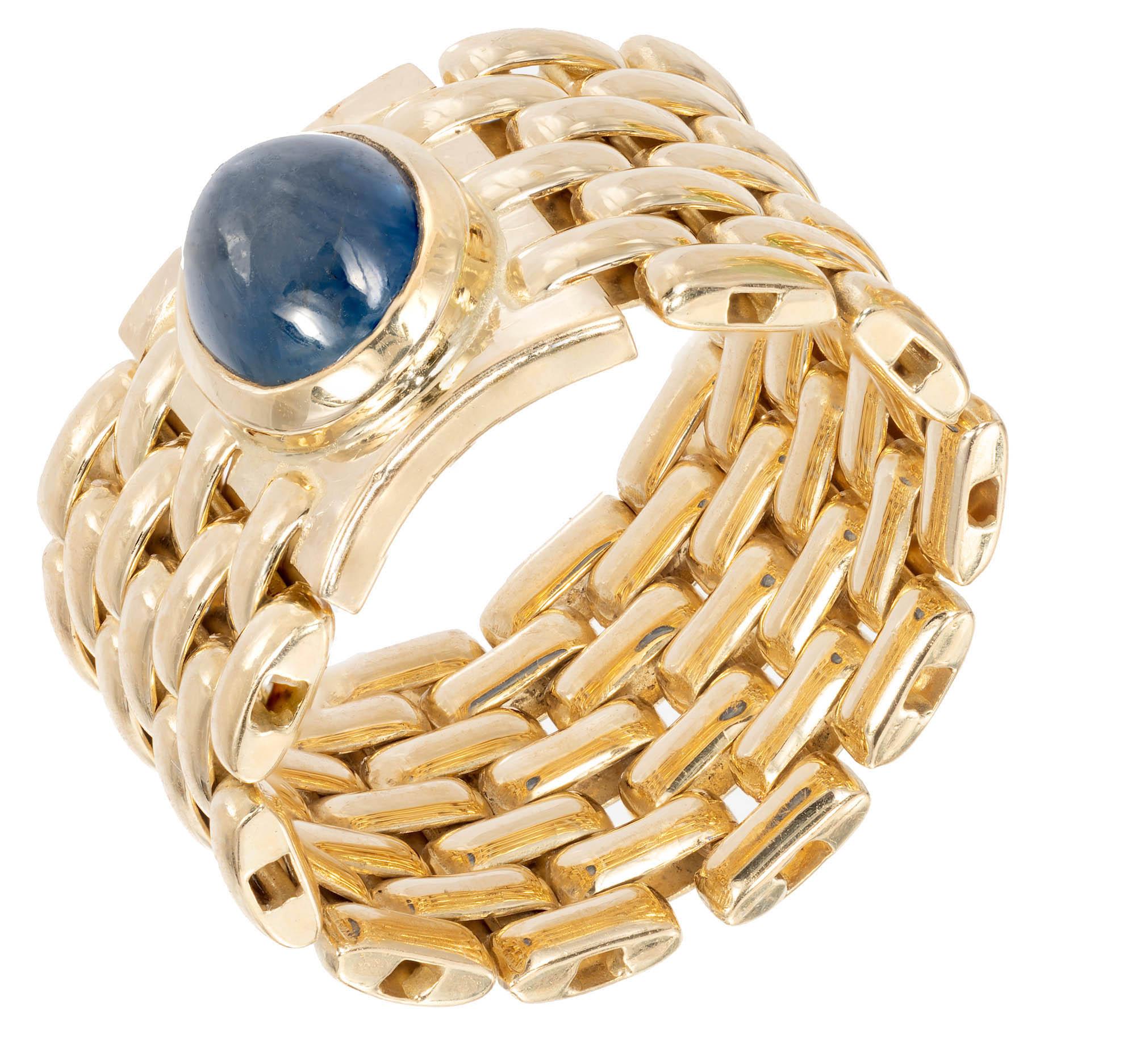 Yellow gold blue Sapphire mesh ring. Oval shaped cabochon blue Sapphire is bezel set in 14k yellow gold on a flexible wide mesh band.

1 oval double cabochon blue Sapphire, approx. total weight 2.40cts, 8.3 x 6.4 x 4.61mm
Size 6.5 and not easily