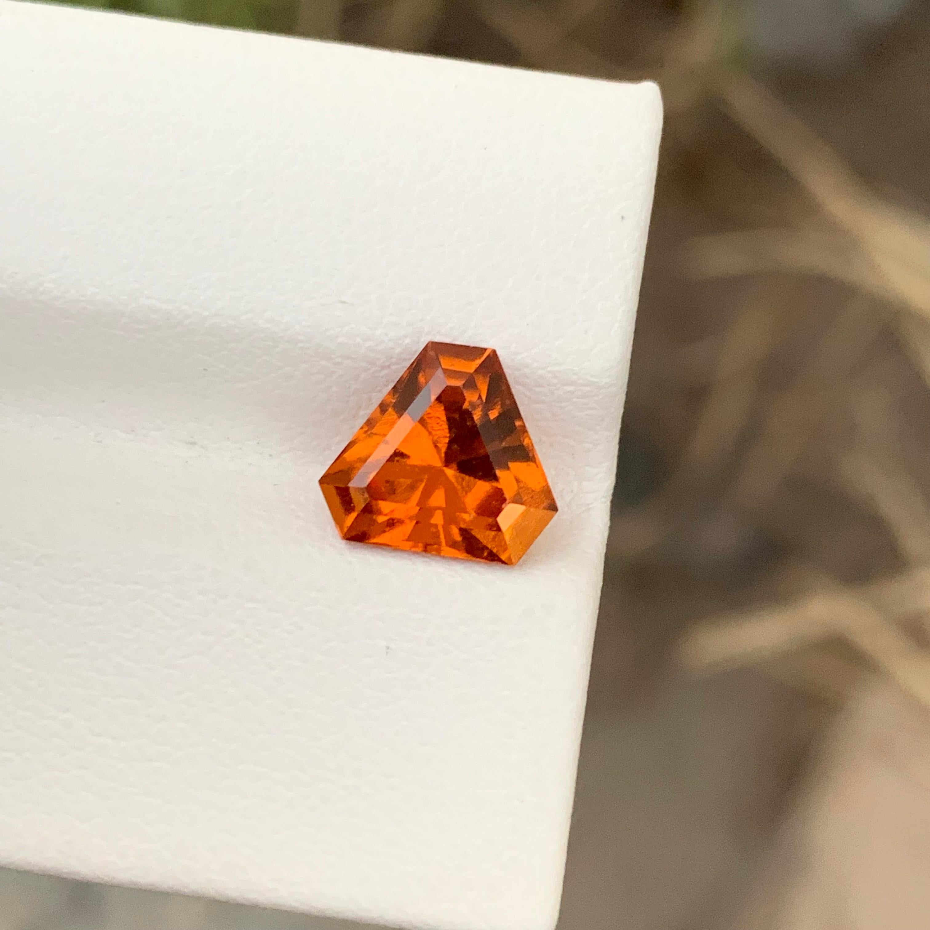 Loose Hessonite Garnet 
Weight: 2.40 Carats
Dimension: 8.2 x 8.2 x 5 Mm
Colour: Orange
Cut: Trillion 
Certificate: On Demand

Hessonite garnet, also known as cinnamon stone or gomedh, is a captivating gemstone renowned for its warm hues and