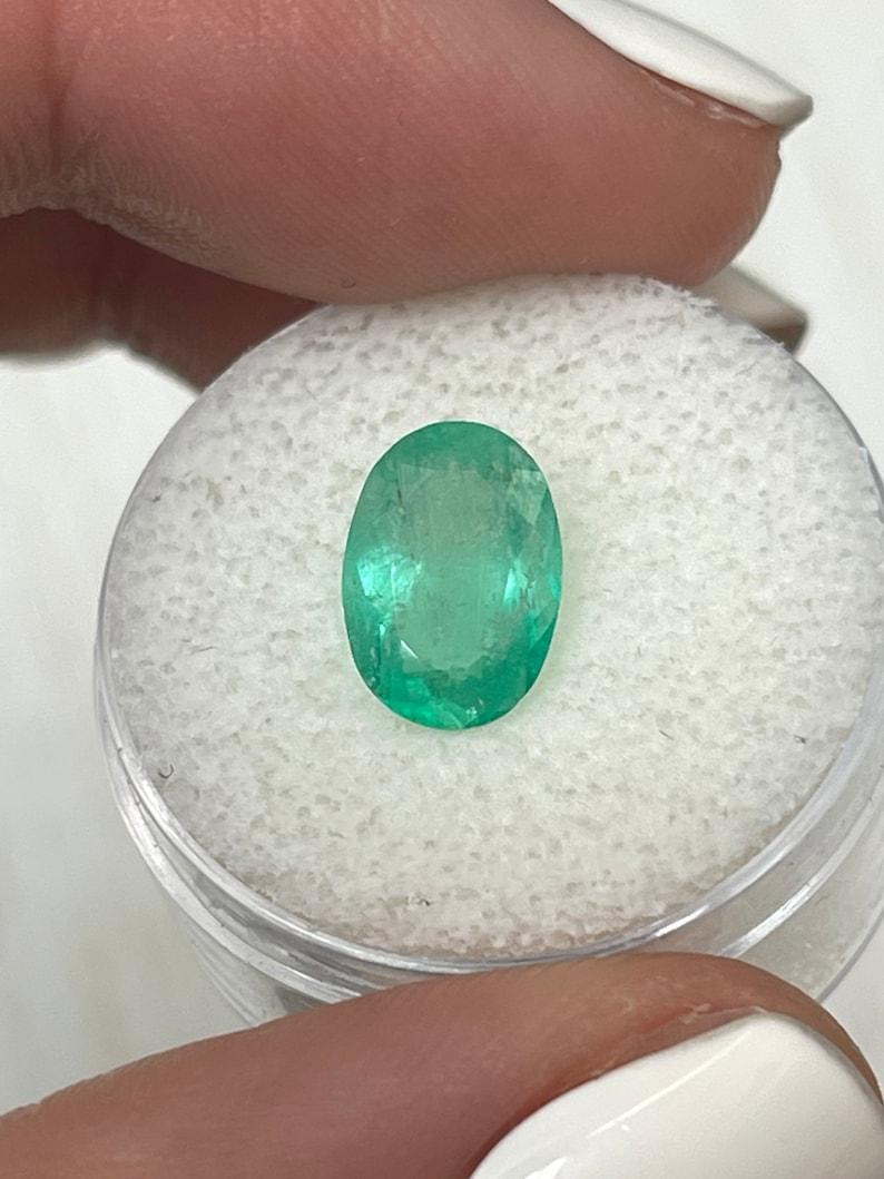 Stone: Emerald
Weight: 2.40-carats
Shape: Oval Cut
Clarity: Semi-Transparent
Luster: Good
Color: Medium Light Green
Measurements: 10.69mm x 7.65mm x 5.05mm
Geographic Origin: Colombia
Treatment: Natural, Oiling

Comments: Due to their growth