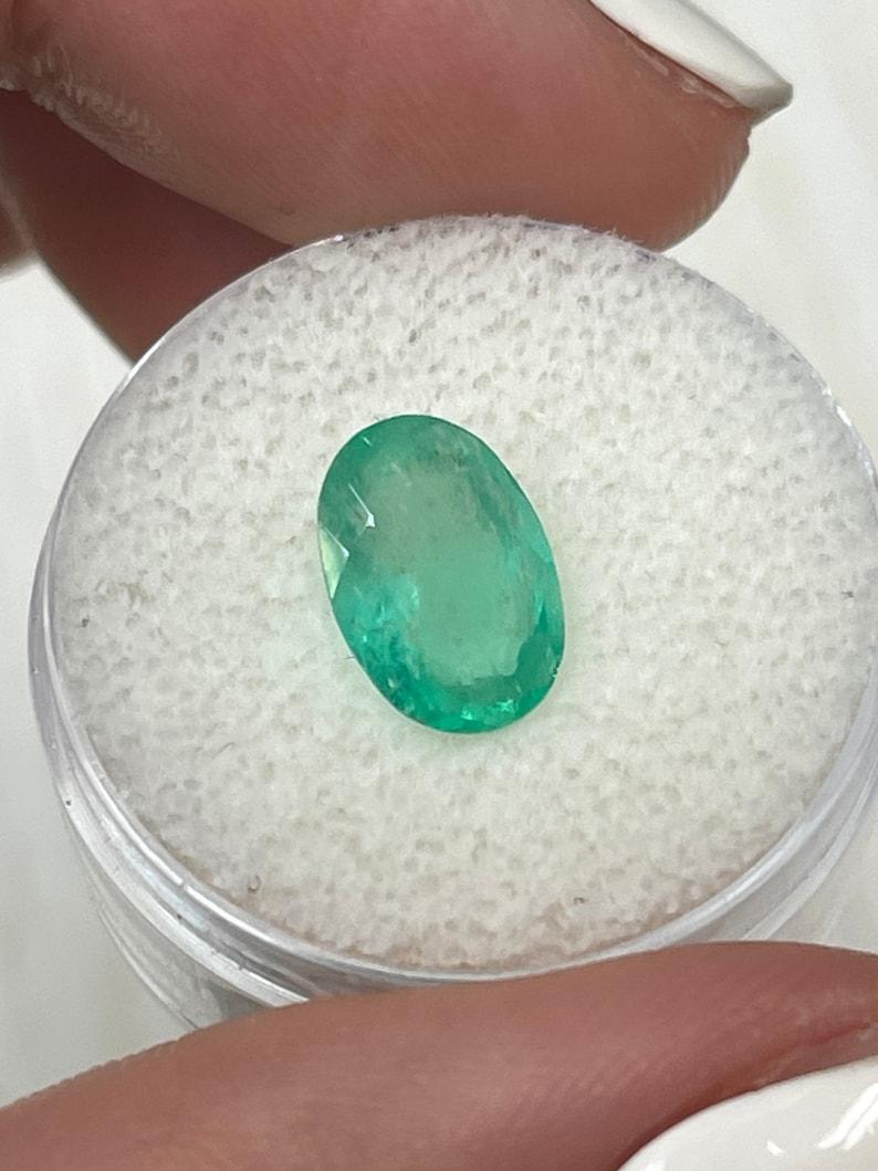 Modern 2.40 Carat Slender Medium Light Green Colombian Emerald - Oval Cut May Gem For Sale