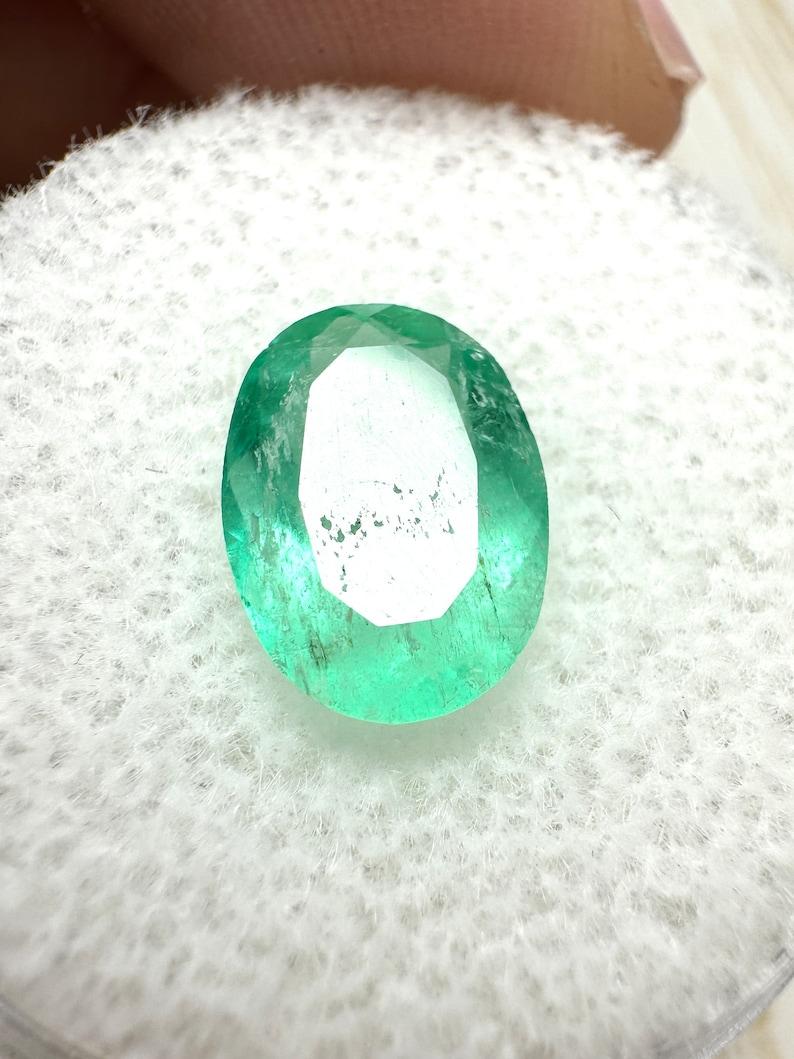 2.40 Carat Slender Medium Light Green Colombian Emerald - Oval Cut May Gem In New Condition For Sale In Jupiter, FL