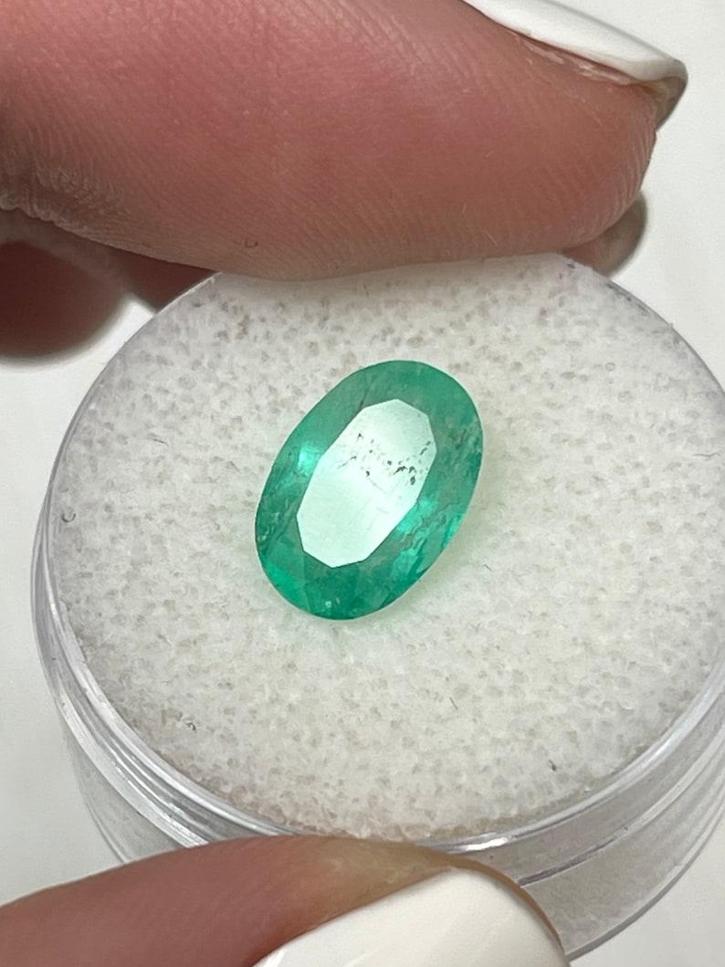 Women's or Men's 2.40 Carat Slender Medium Light Green Colombian Emerald - Oval Cut May Gem For Sale