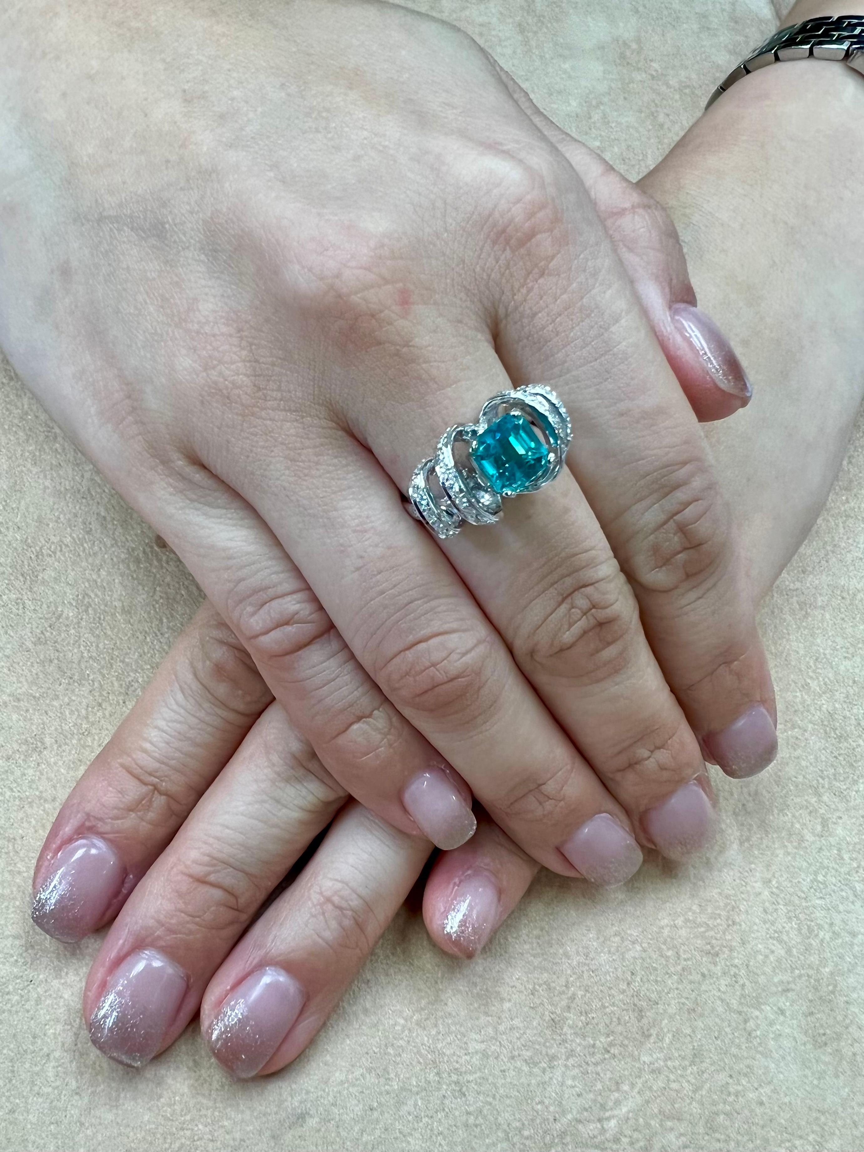 Please check out the HD video! Here is a super unique Apatite and diamond ring. It is set in 18k white gold and diamonds. The 2.40 cts center Apatite is stunning. The beautiful blue green color is very eye pleasing. Please refer to the video. This