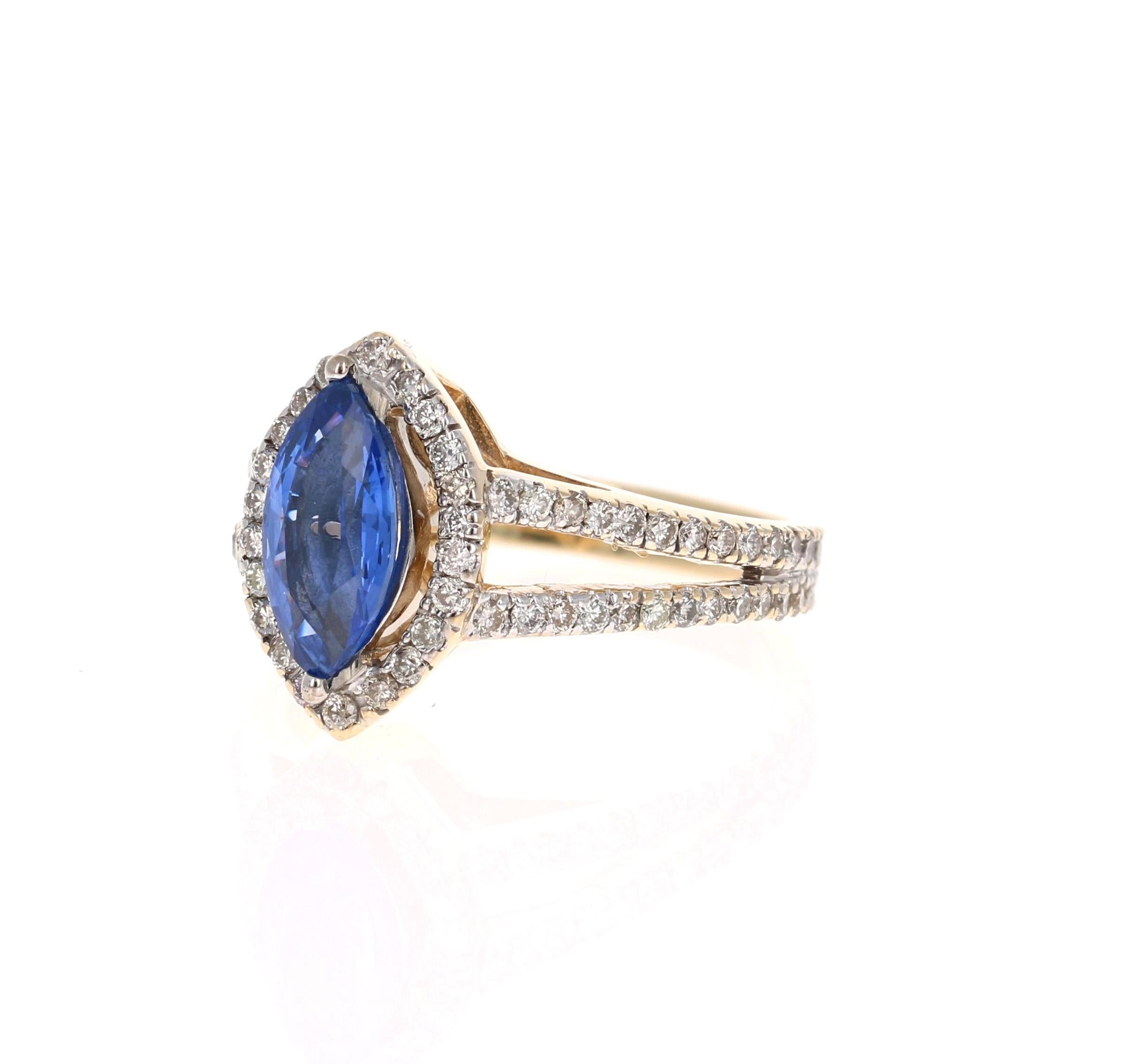This beautiful ring has a vivid 1.67 Carat Marquise Cut Tanzanite. The Tanzanite is surrounded by 78 Round Cut Diamonds that weigh 0.73 carats. (Clarity: VS, Color: H) The total carat weight of the ring is 2.40 carats. 

The ring is made in 14K
