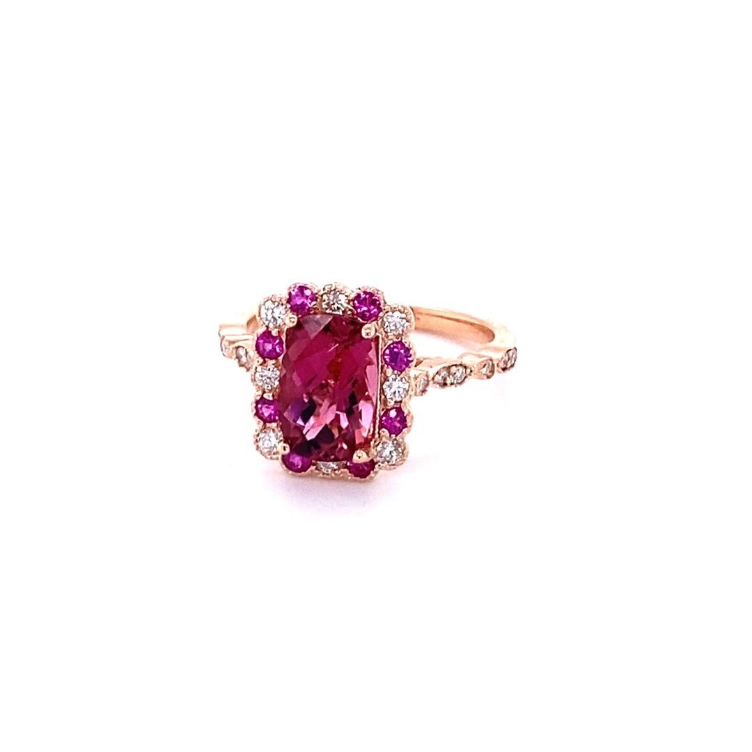 Pretty and dainty Tourmaline, Diamond and Sapphire ring that can transform into a unique proposal ring!
2.40 Carat Tourmaline Diamond Sapphire 14K Rose Gold Bridal Ring

Item Specs.:

Cushion cut Tourmaline: 1.91 cts.
20 Round Cut Diamonds: 0.32